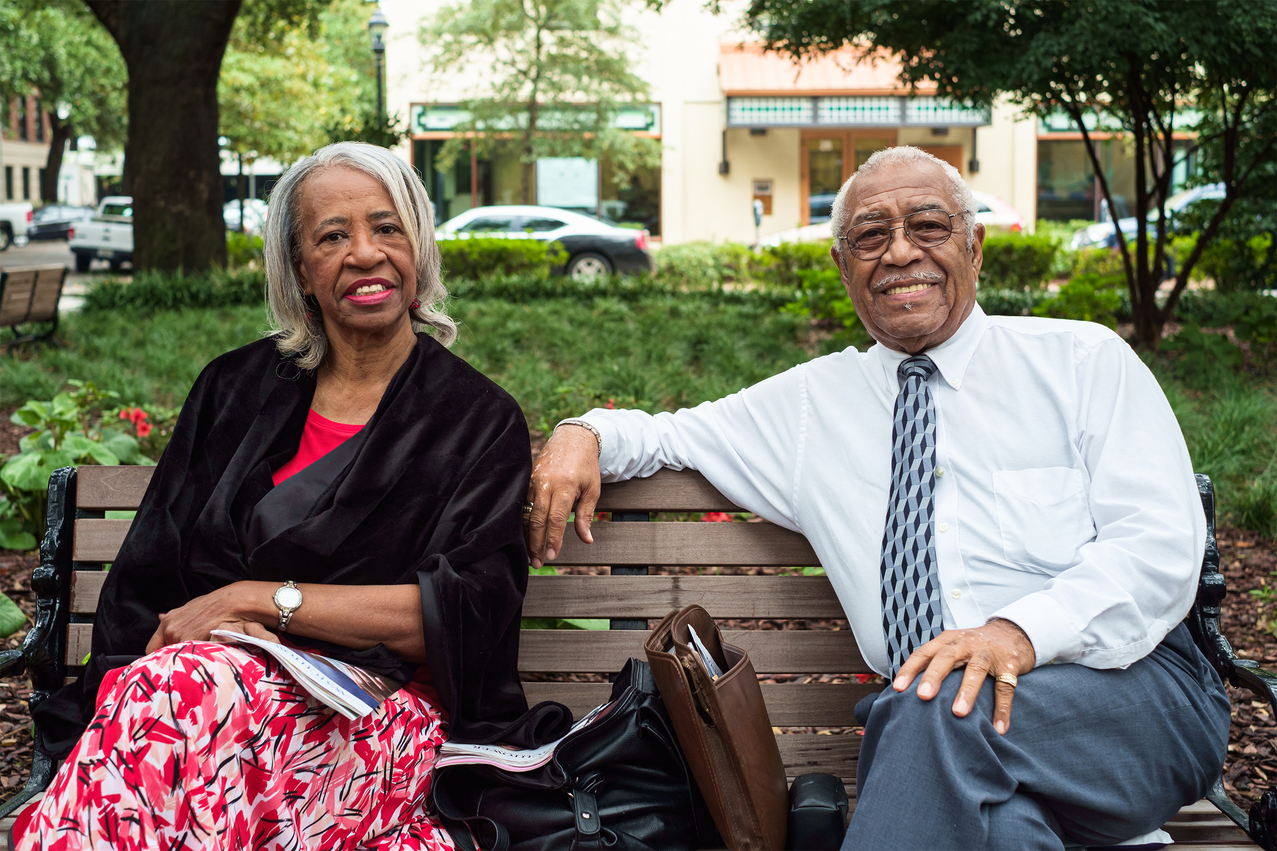 Couple in Savannah, Georgia sitting on a bench