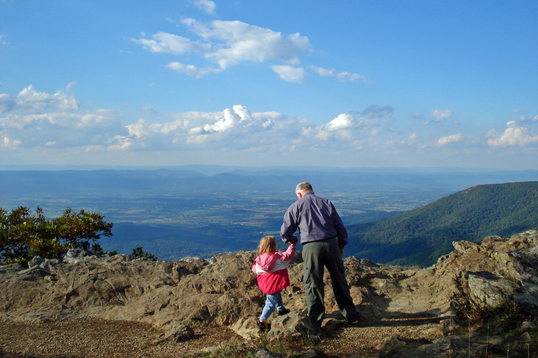 senior and grandchild hiking in shenandoah national park
