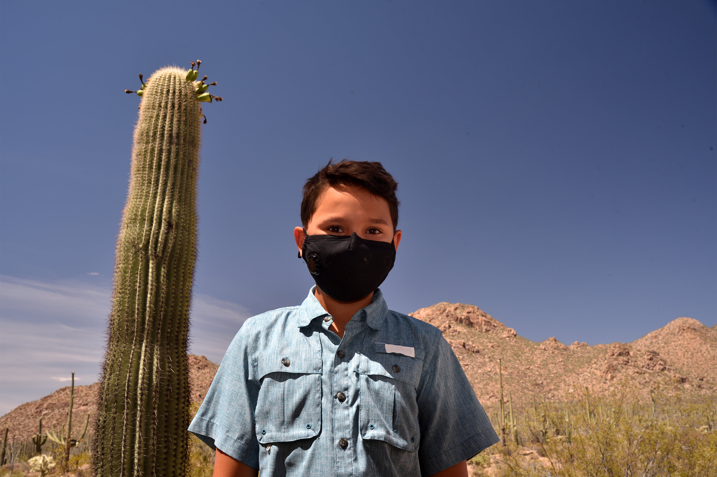 Young boy with Covid mask in Seguaro National Park, Arizona