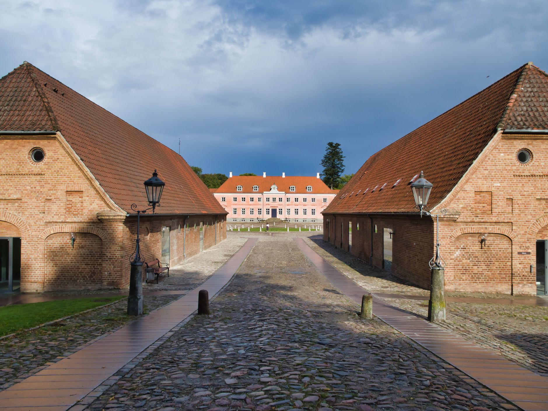 Aarhus, Midtjylland, Denmark - September 7, 2019: Footpath amidst buildings of the Aarhus University (Campus Moesgaard) against sky.
