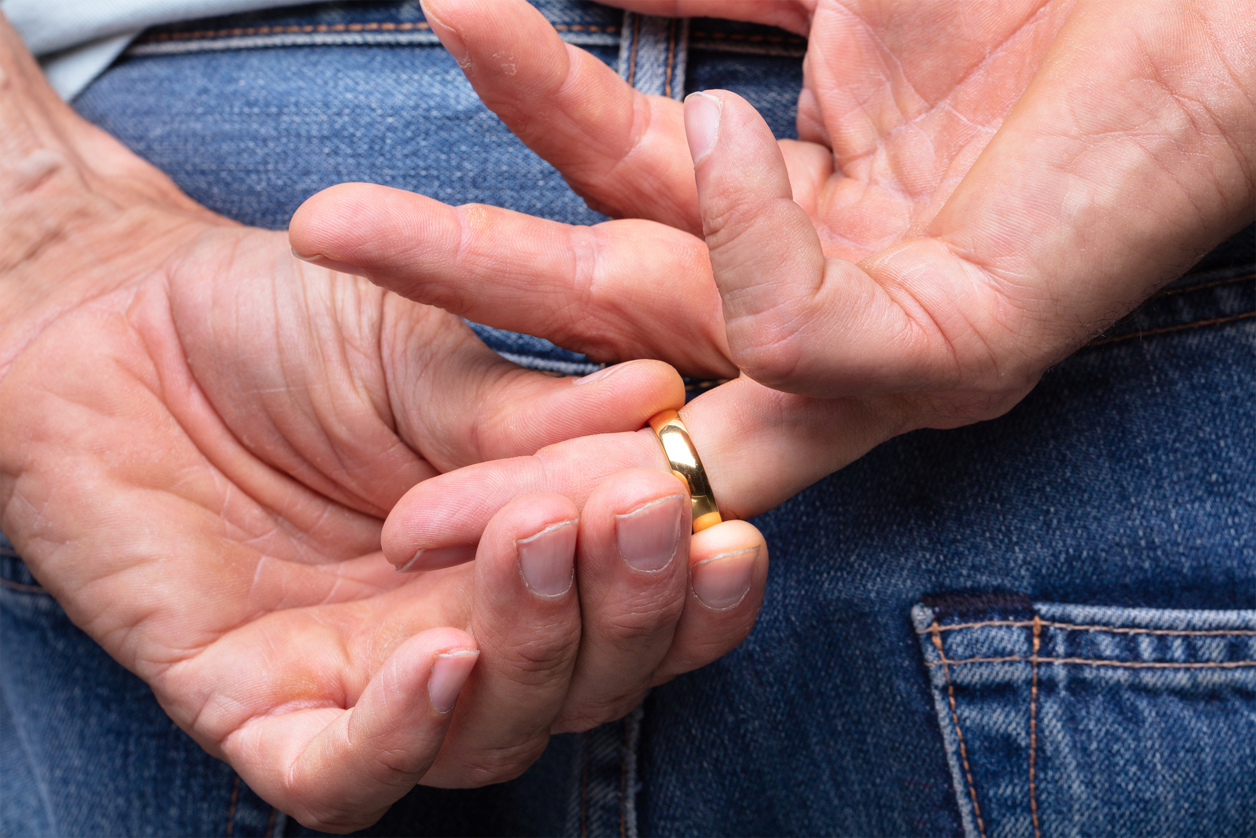man holding wedding ring
