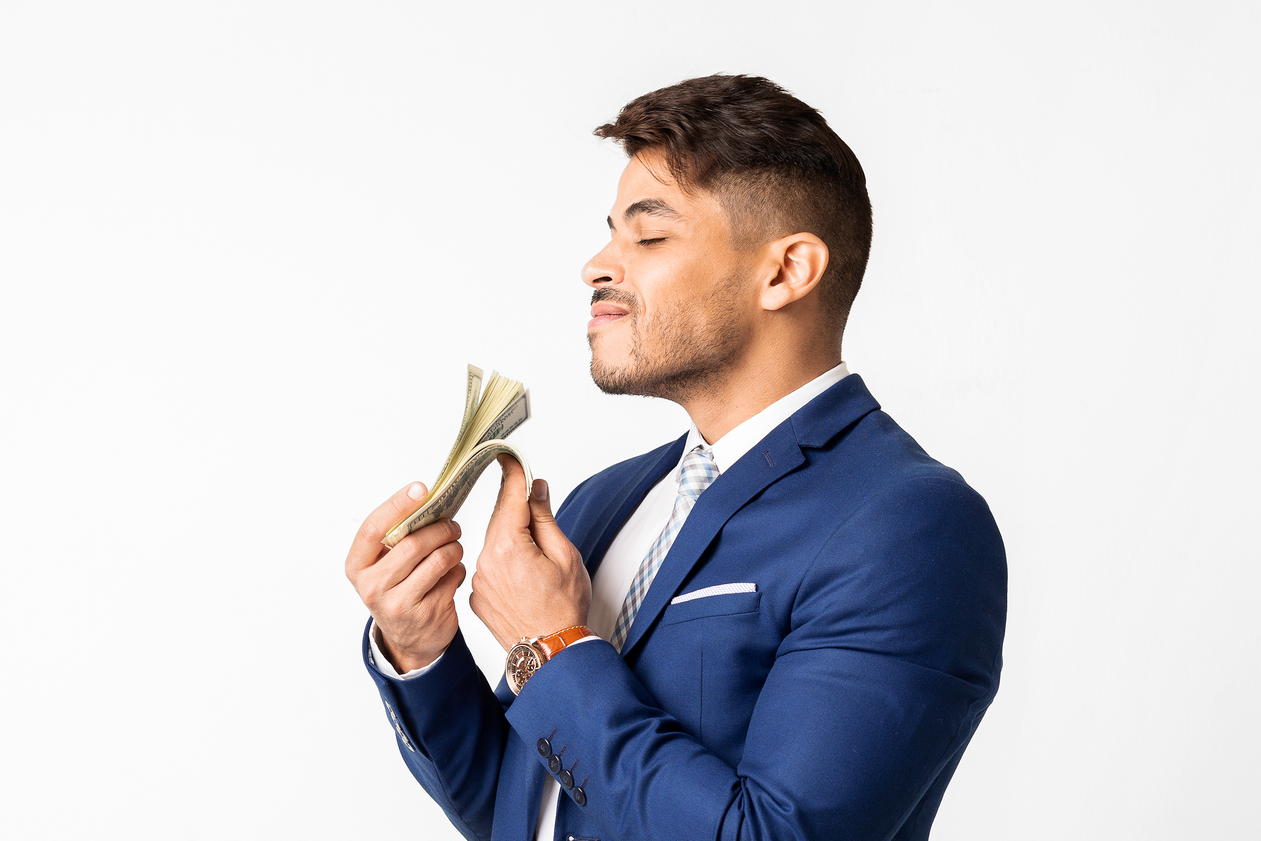 man smelling money