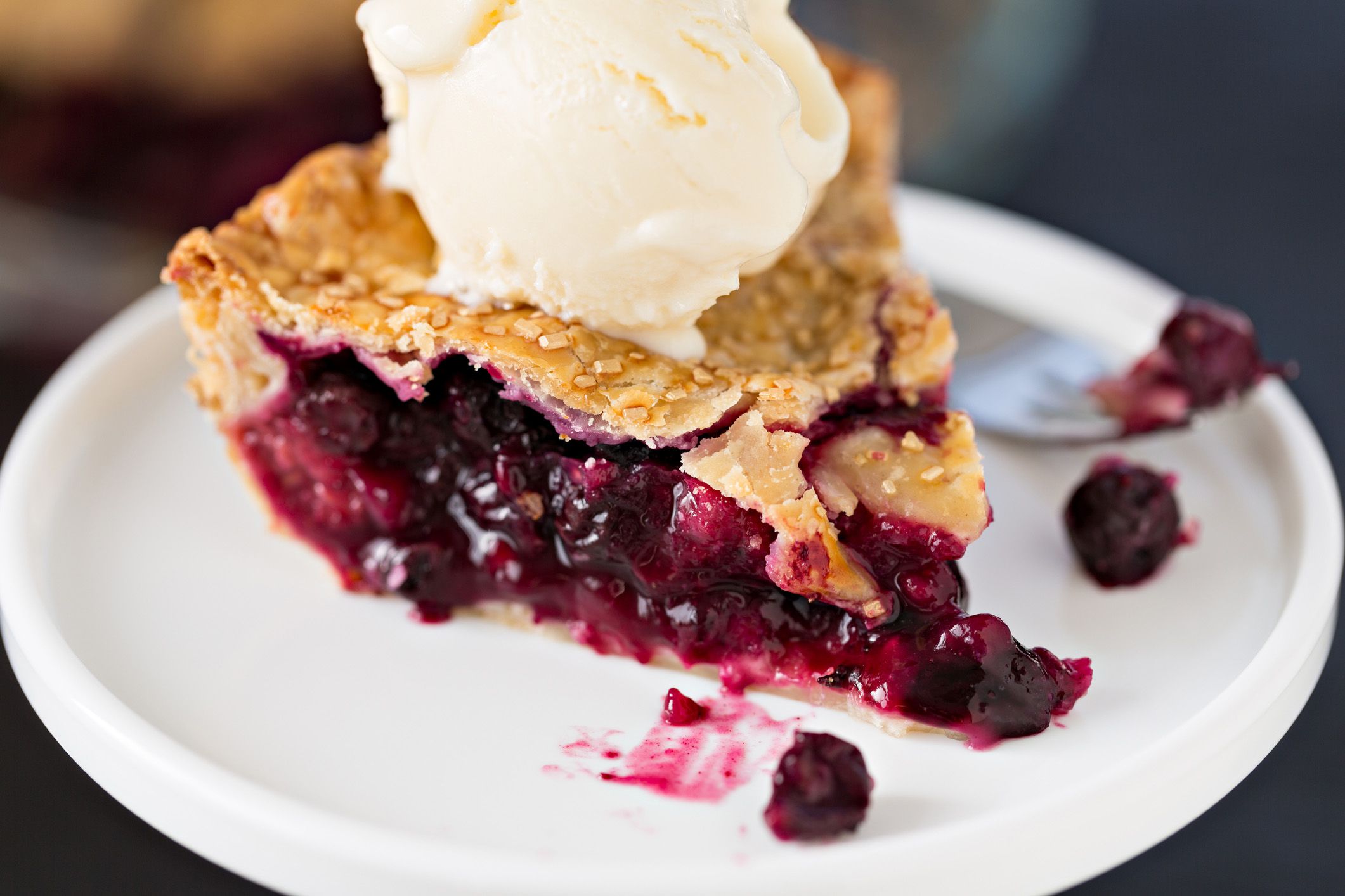 berry pie and ice cream on plate