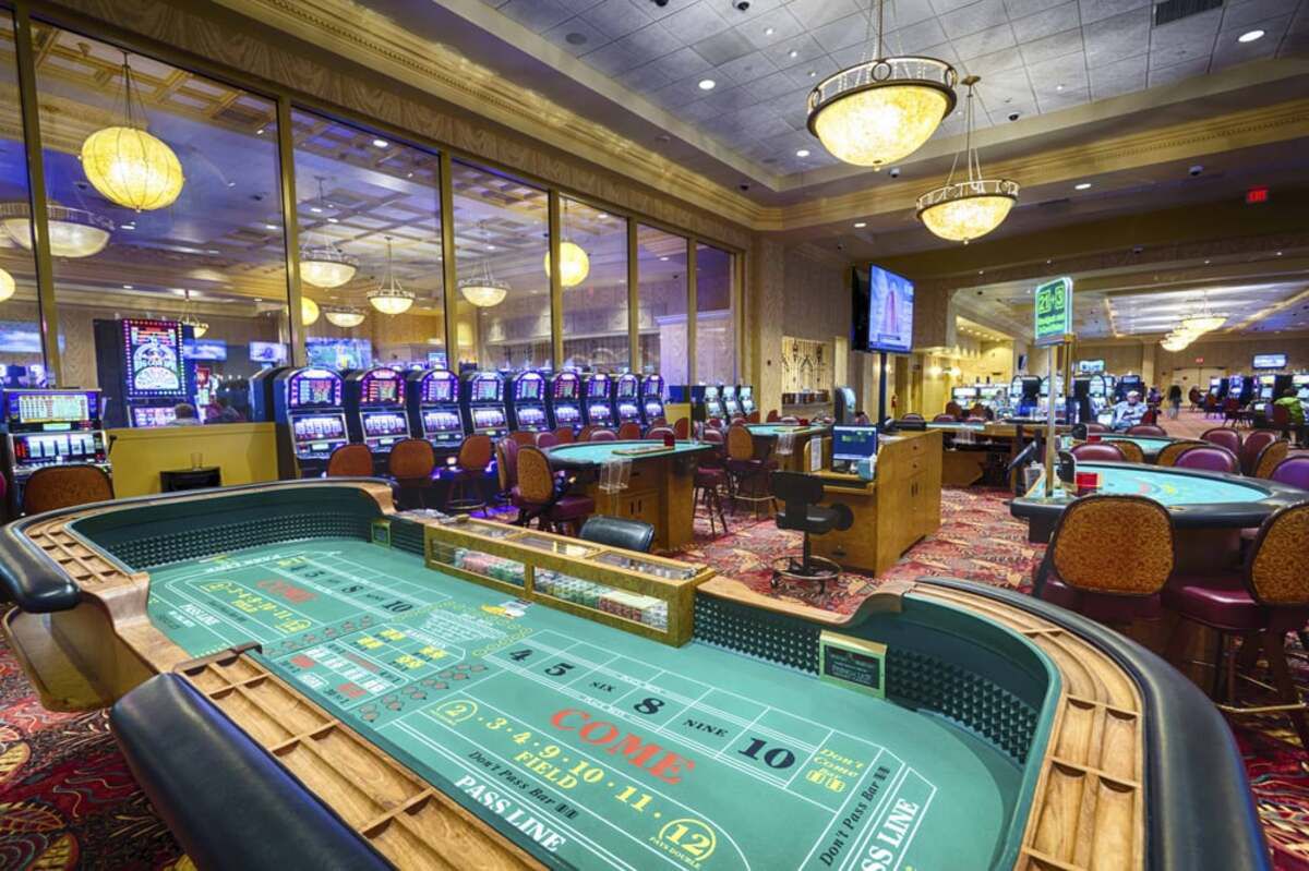 French Lick Resort Casino, French Lick, Indiana, casino room with card tables in the foreground, slot machines in the background