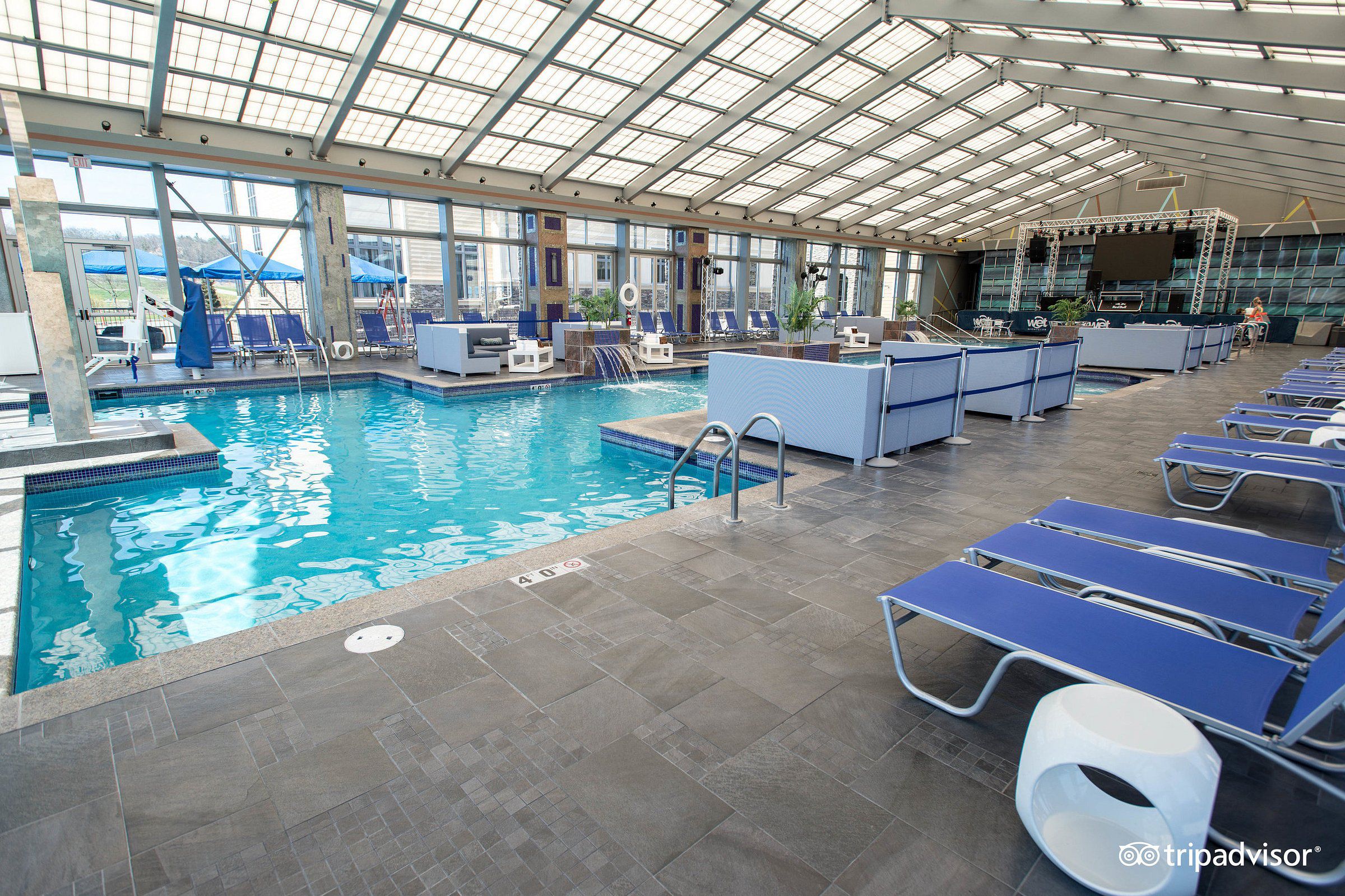 Mount Airy Casino Resort, Pocono, Pennsylvania, large indoor pool, several lounge seats along the right foreground