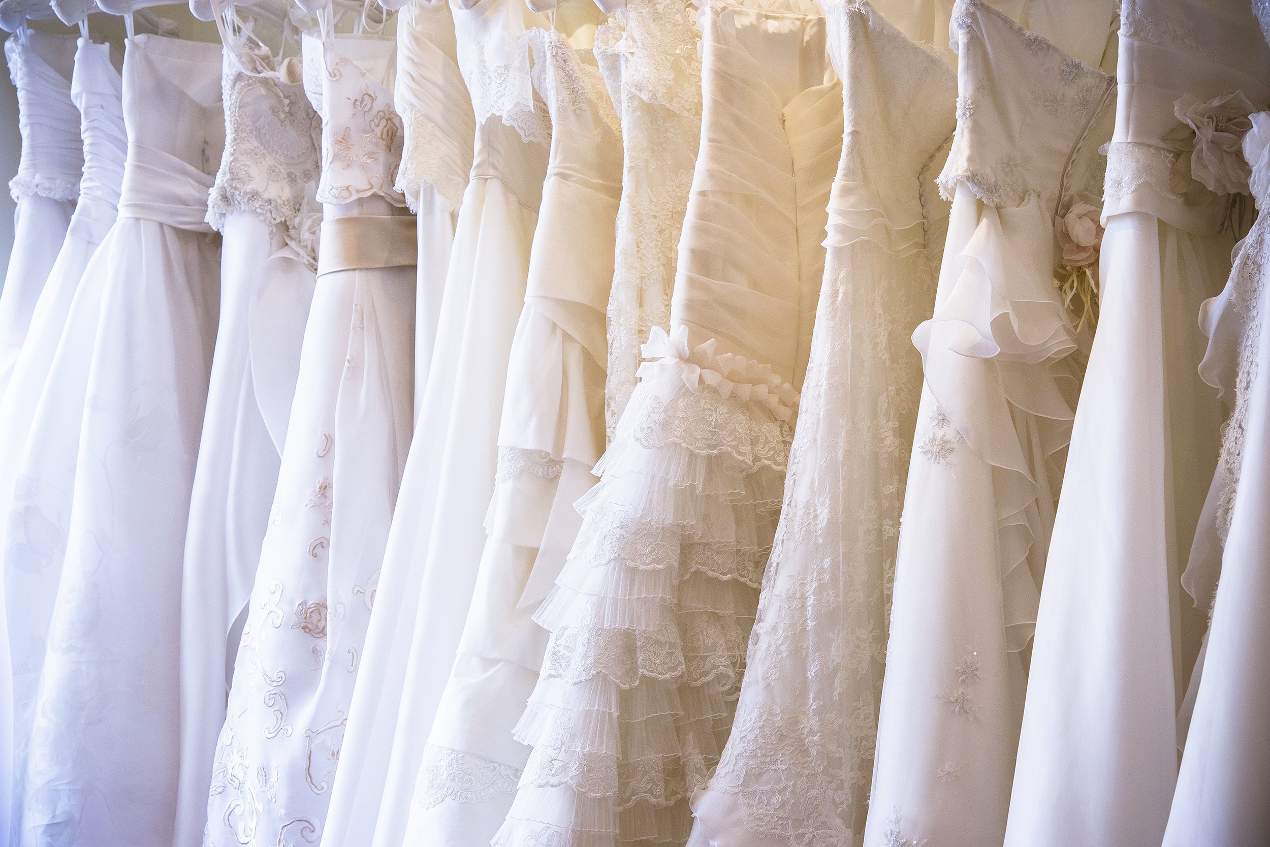 wedding dresses hanging up
