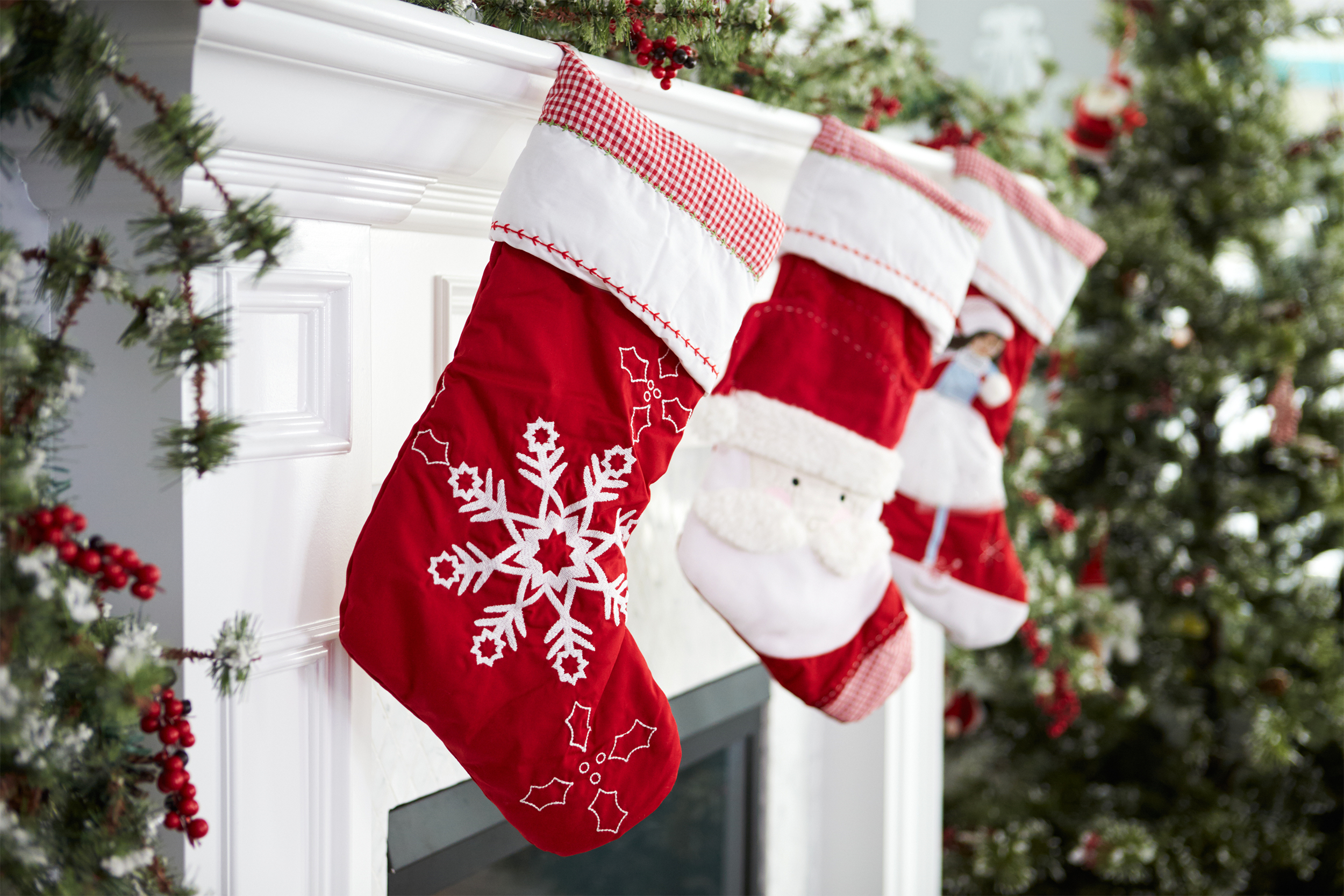 Christmas stockings hanging over fireplace