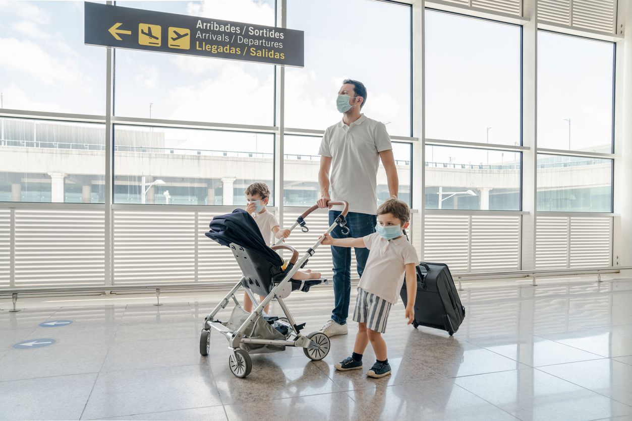 family flying with mask