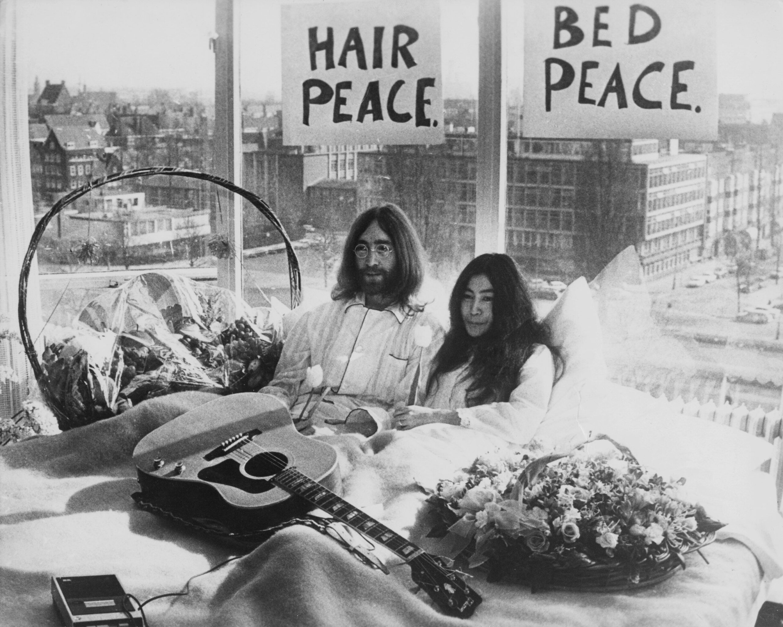 Beatle John Lennon (1940 � 1980) and his wife of a week Yoko Ono in their bed in the Presidential Suite of the Hilton Hotel, Amsterdam, 25th March 1969. The couple are staging a 'bed-in for peace' and intend to stay in bed for seven days 'as a protest aga