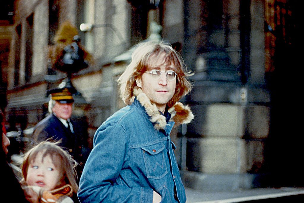 Former Beatle John Lennon poses for a photo with his wife Yoko Ono and son Sean Lennon in 1977 in New York City, New York.
