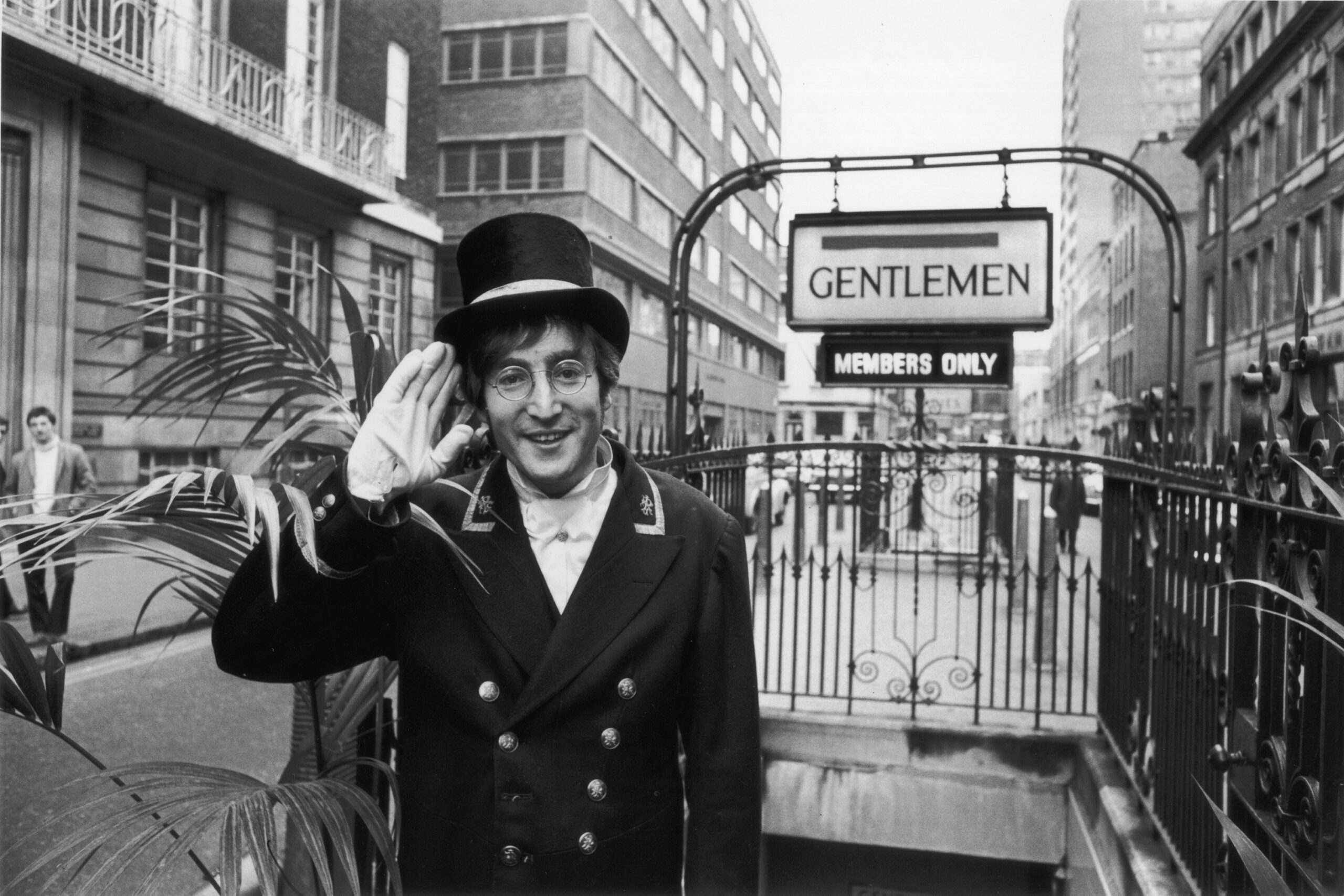 27th November 1966: British rock musician and member of The Beatles, John Lennon (1940 - 1980), dressed as a Public Lavatory Commissionaire during the filming of the 'Not Only...But Also' Christmas Special, starring Peter Cook and Dudley Moore. He is outs