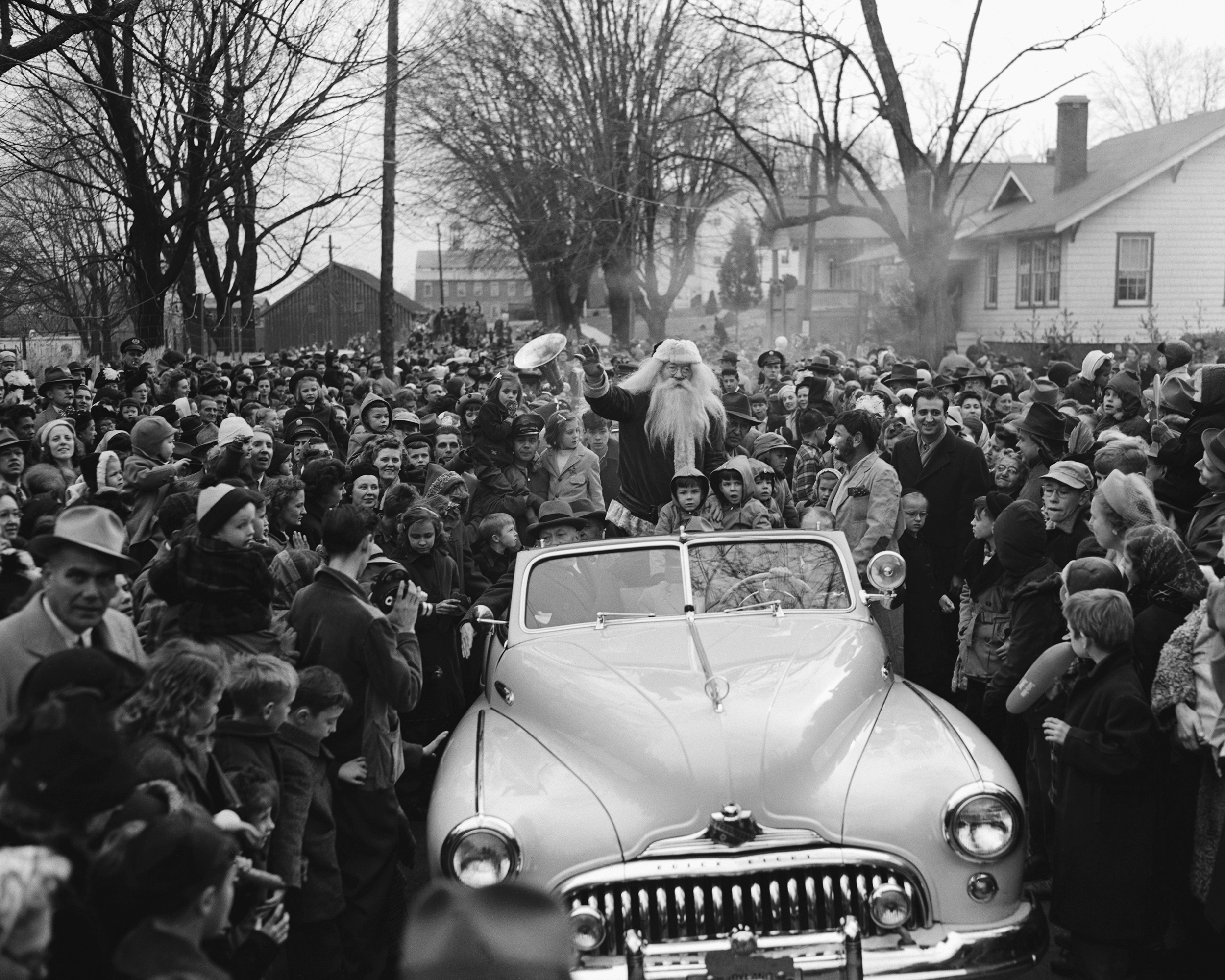 Santa Claus in Convertible in Parade