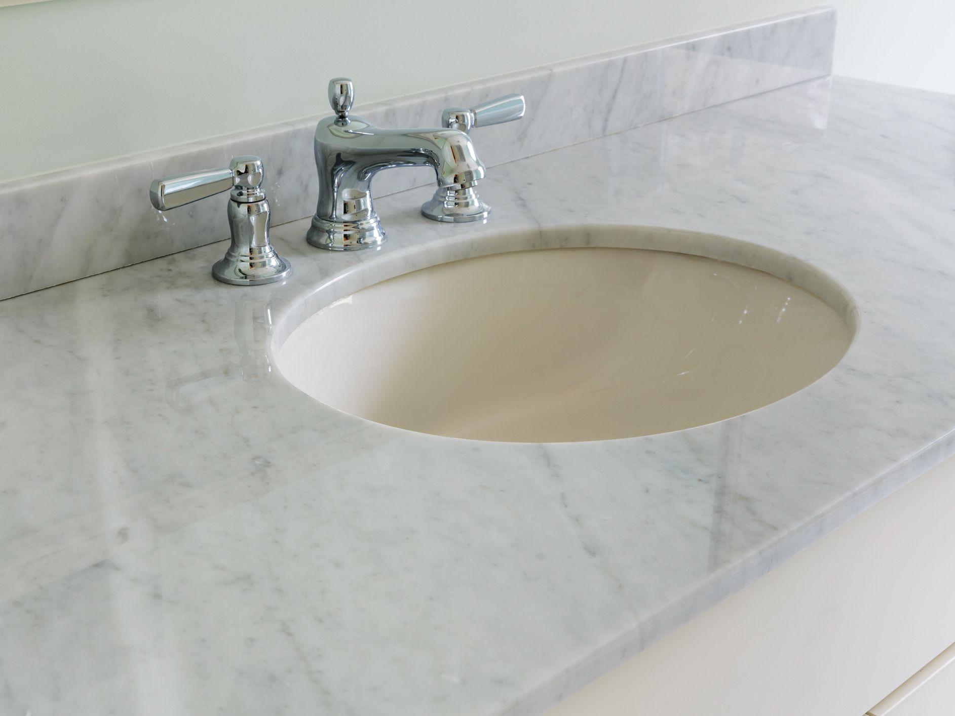 Bright, airy bathroom with marble counter top in a luxury house