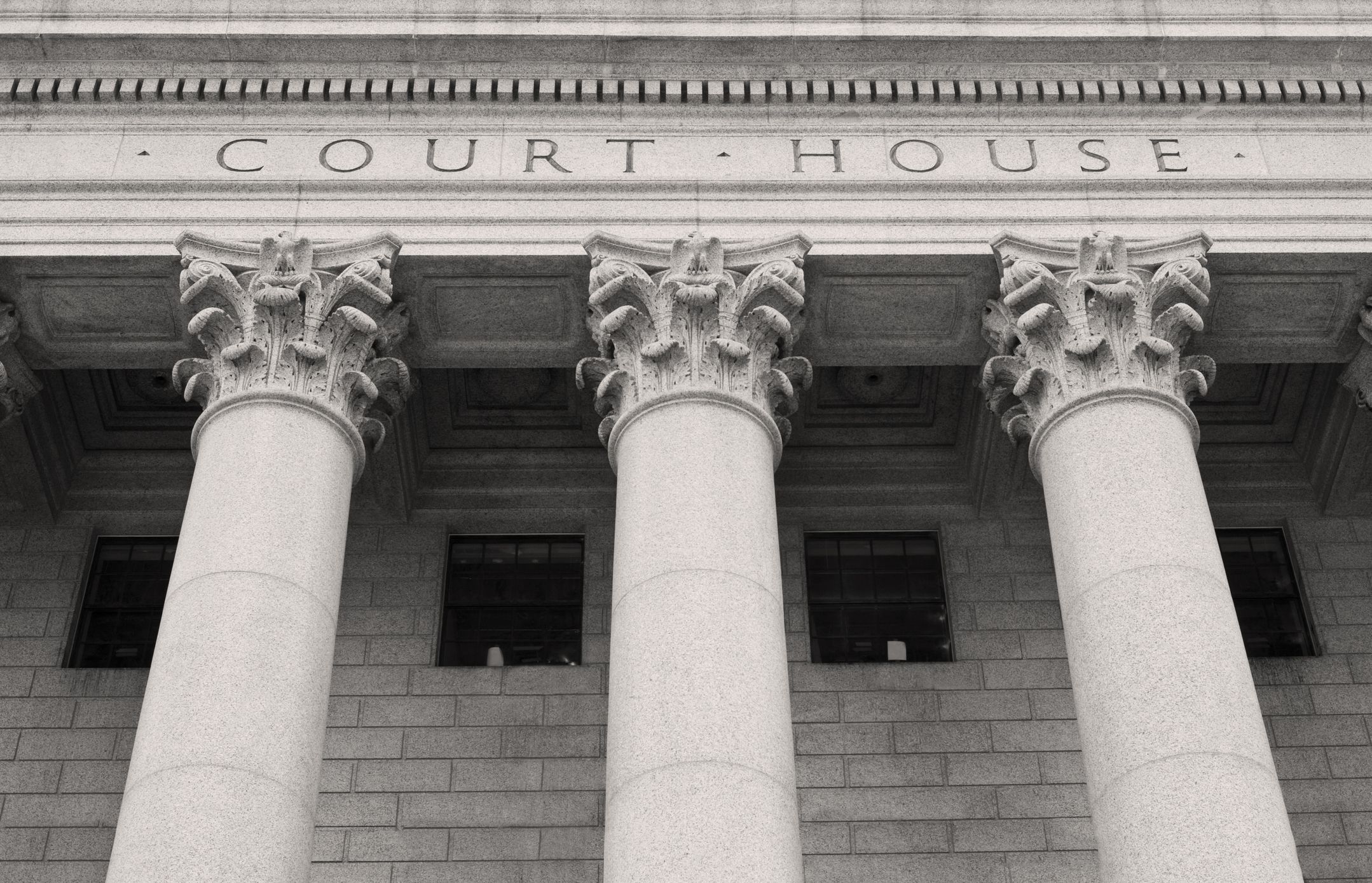 Close up of Courthouse building with pillars and columns .