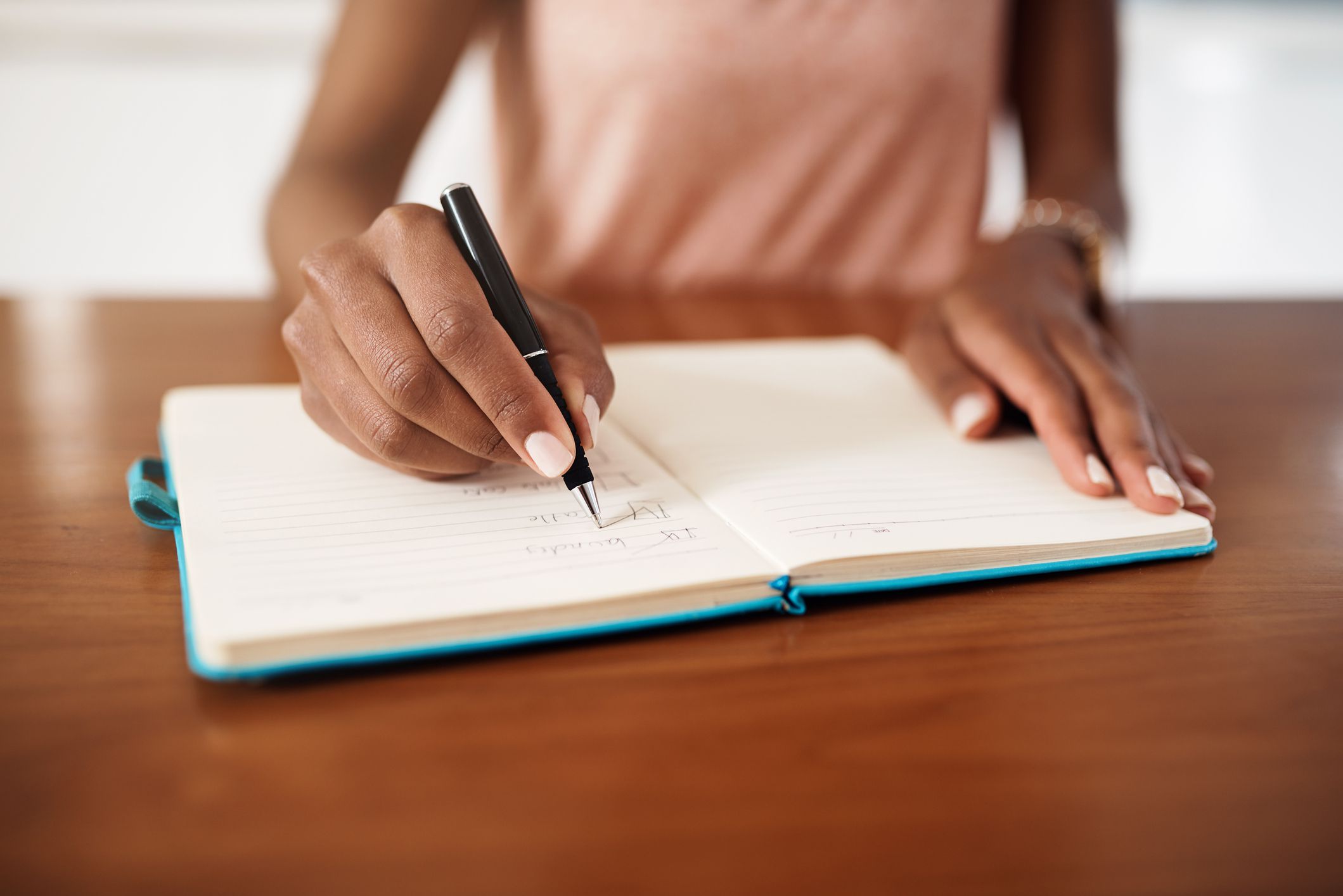 woman writing in planner