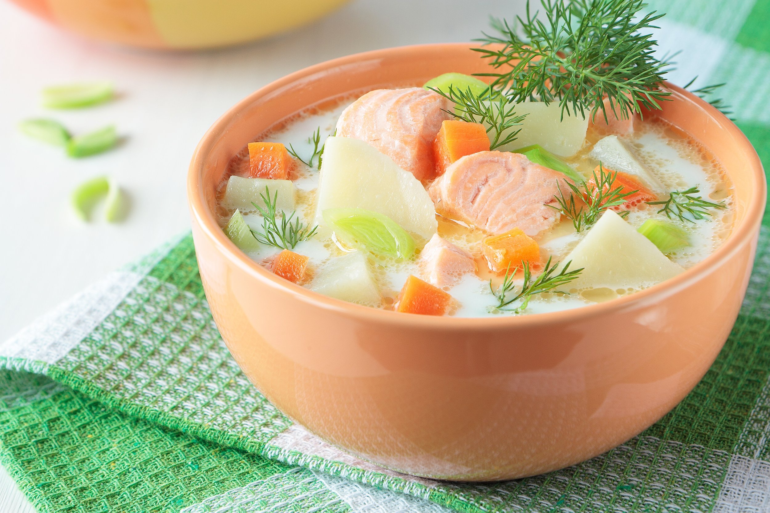salmon soup with cream, potatoes, carrots, dill