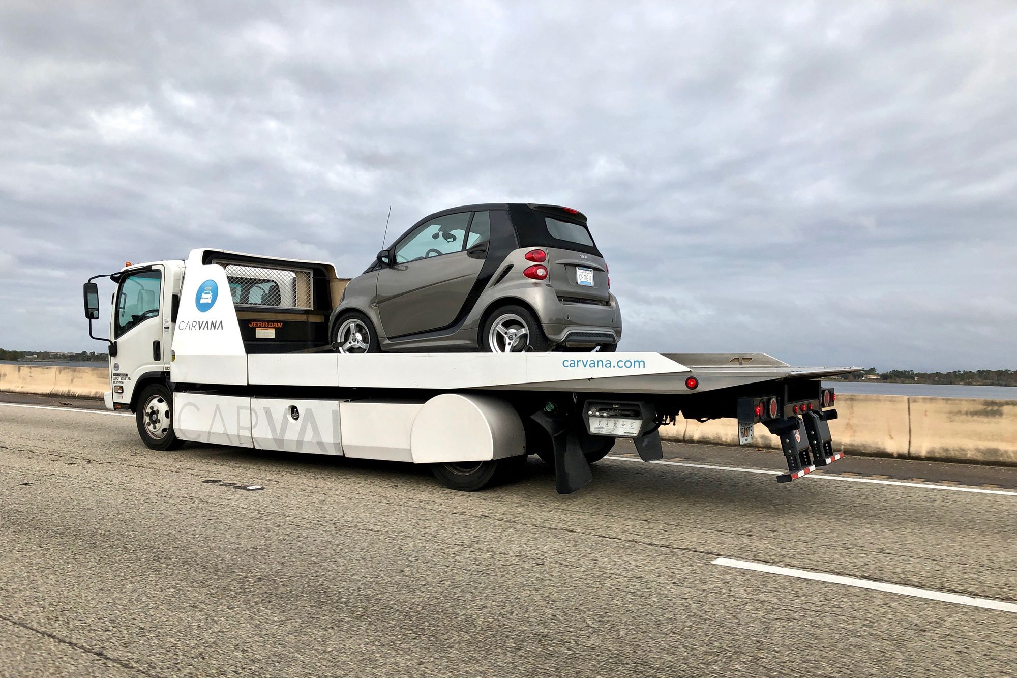 Orlando FL- Carvana.com delivery truck with Smart car on deck
