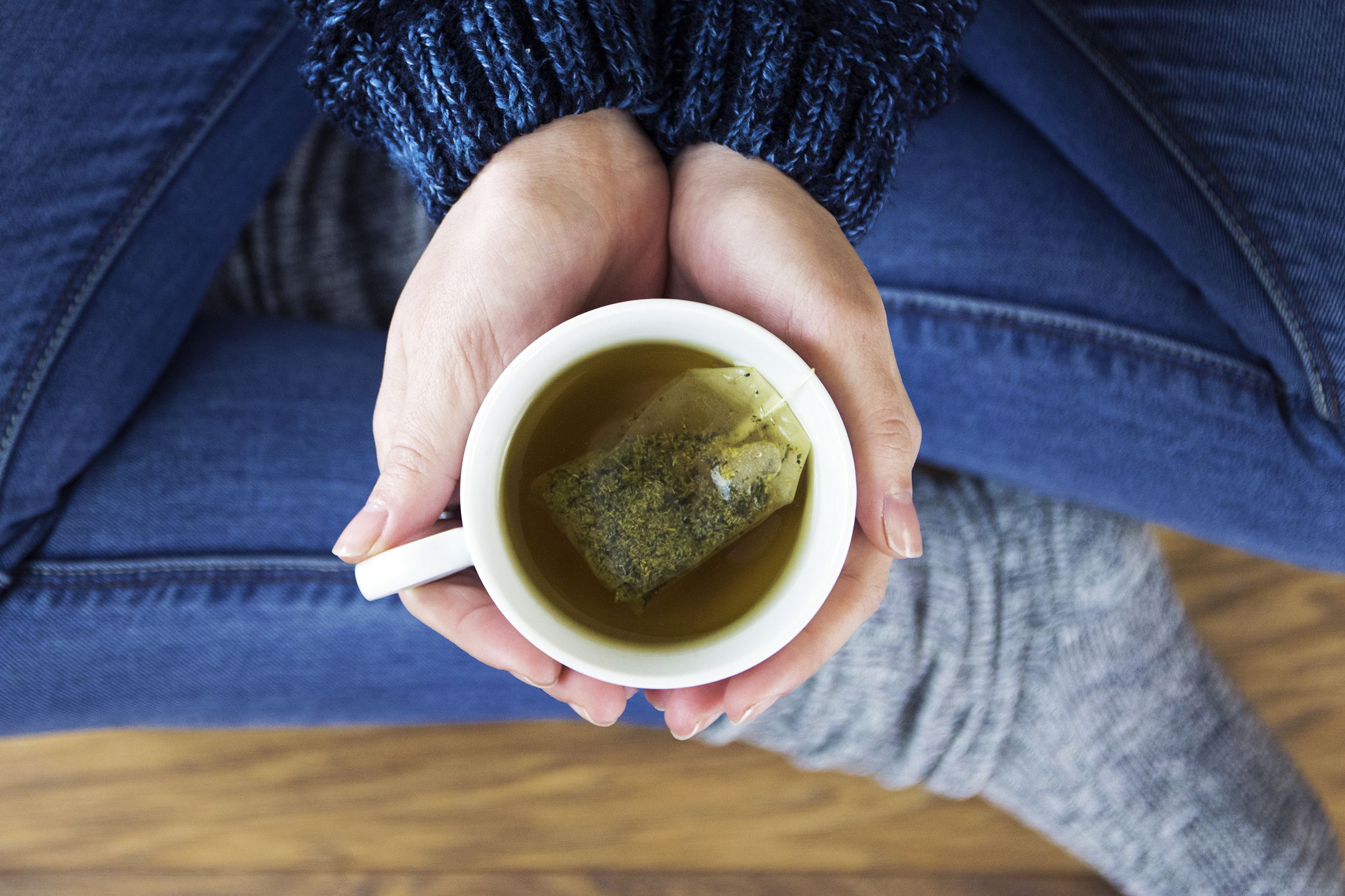 woman having a cup of green tea