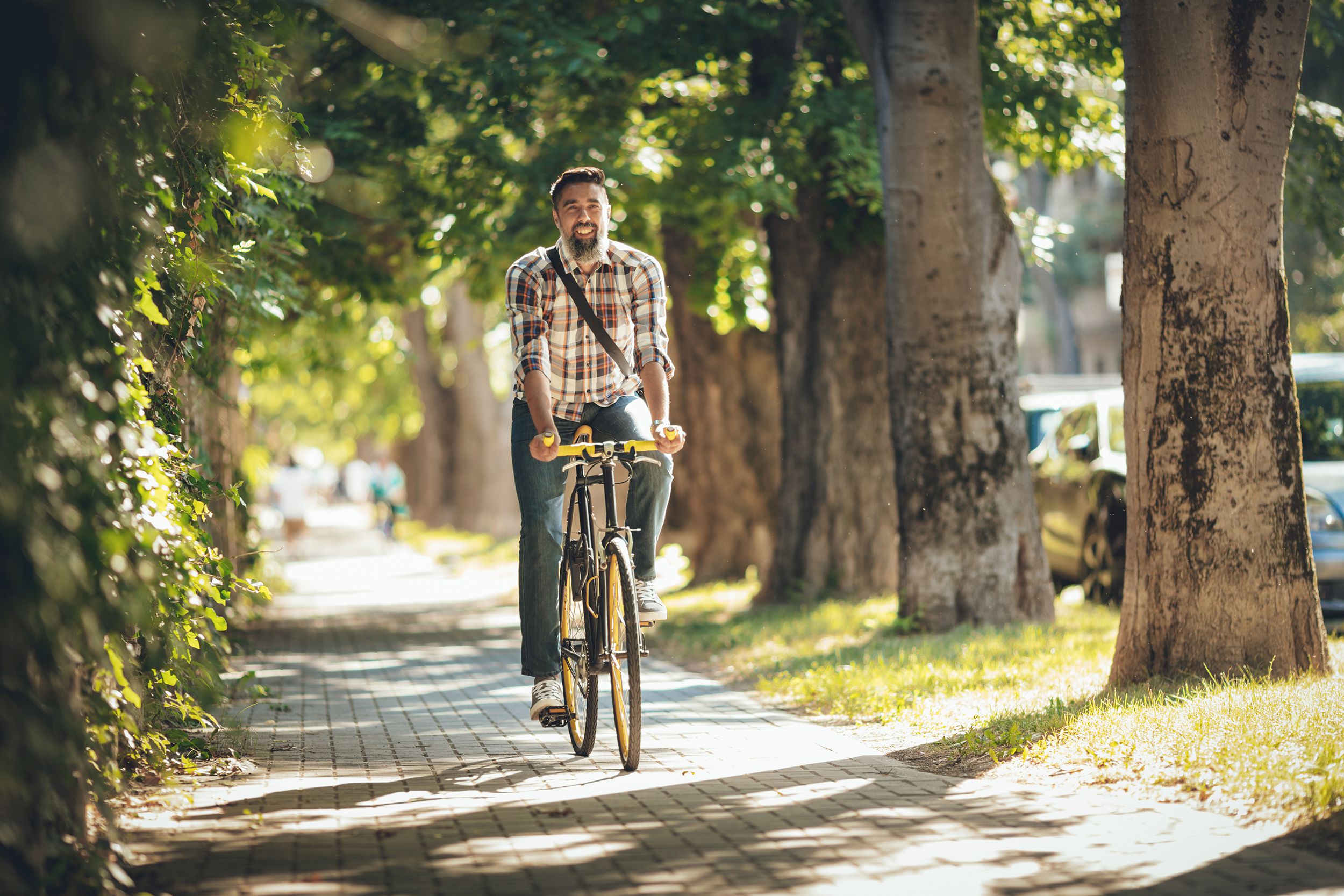 man riding bike in city