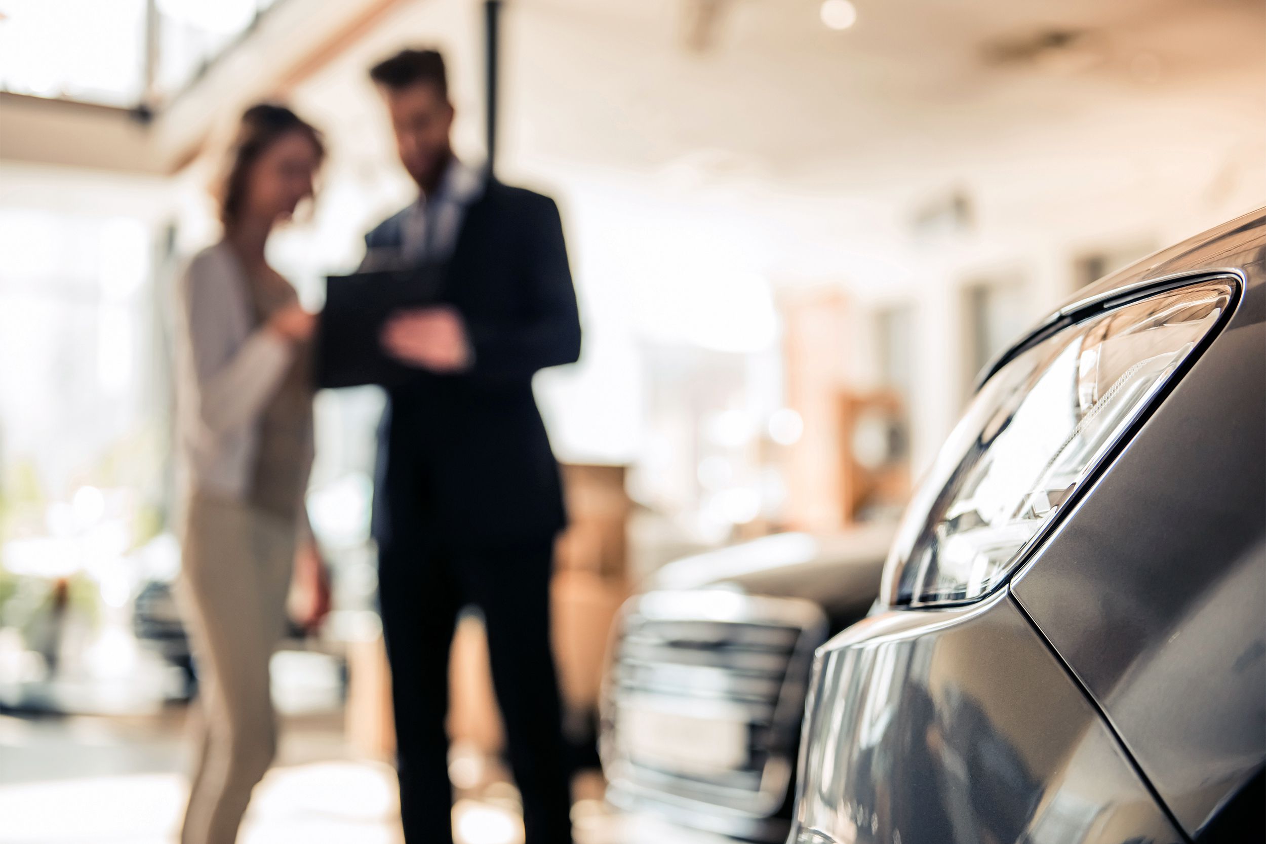 Woman in a car dealership