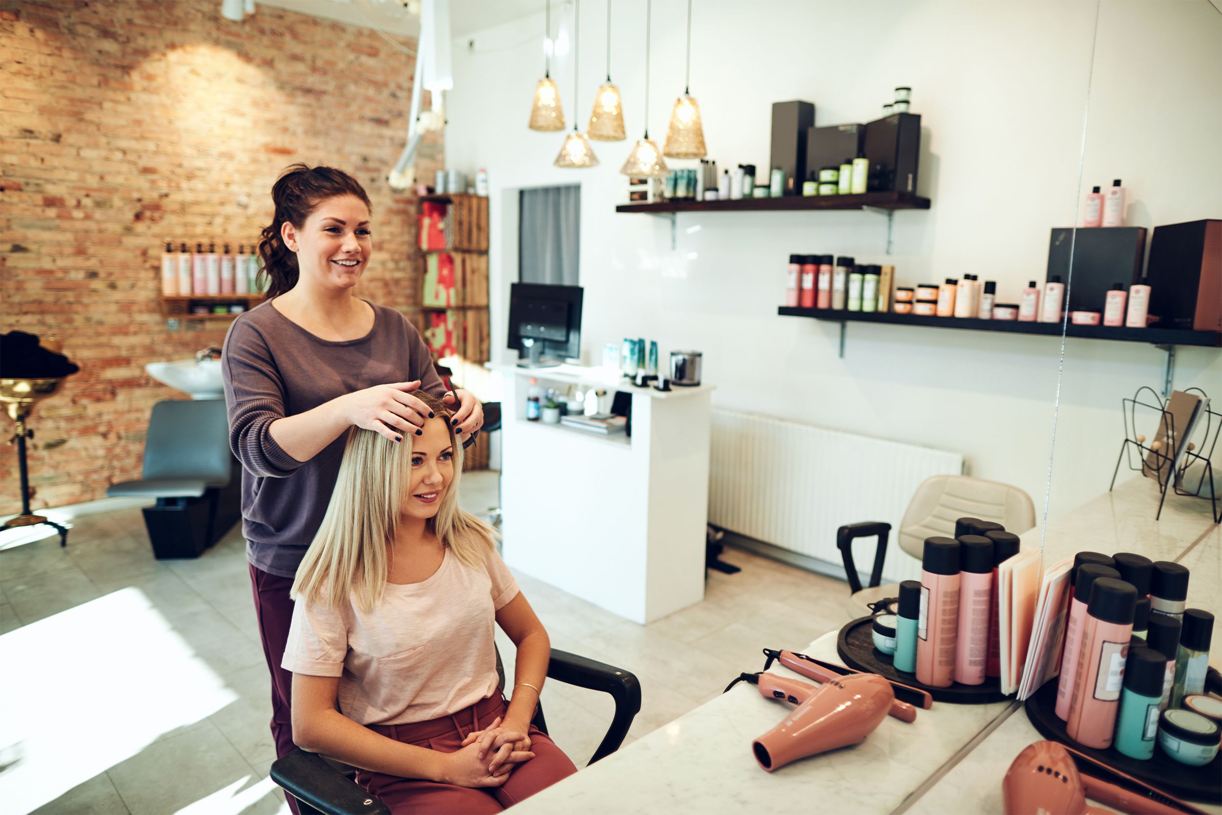 Woman getting her hair cut in a salon