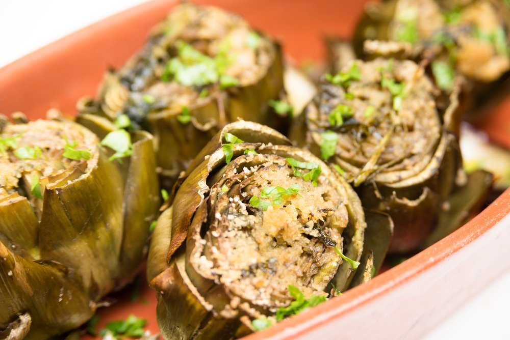 dish of roasted artichoke hearts gratin