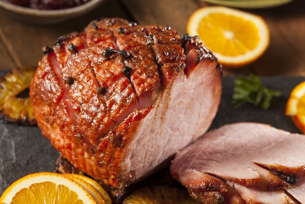honey glazed ham with cloves, sliced