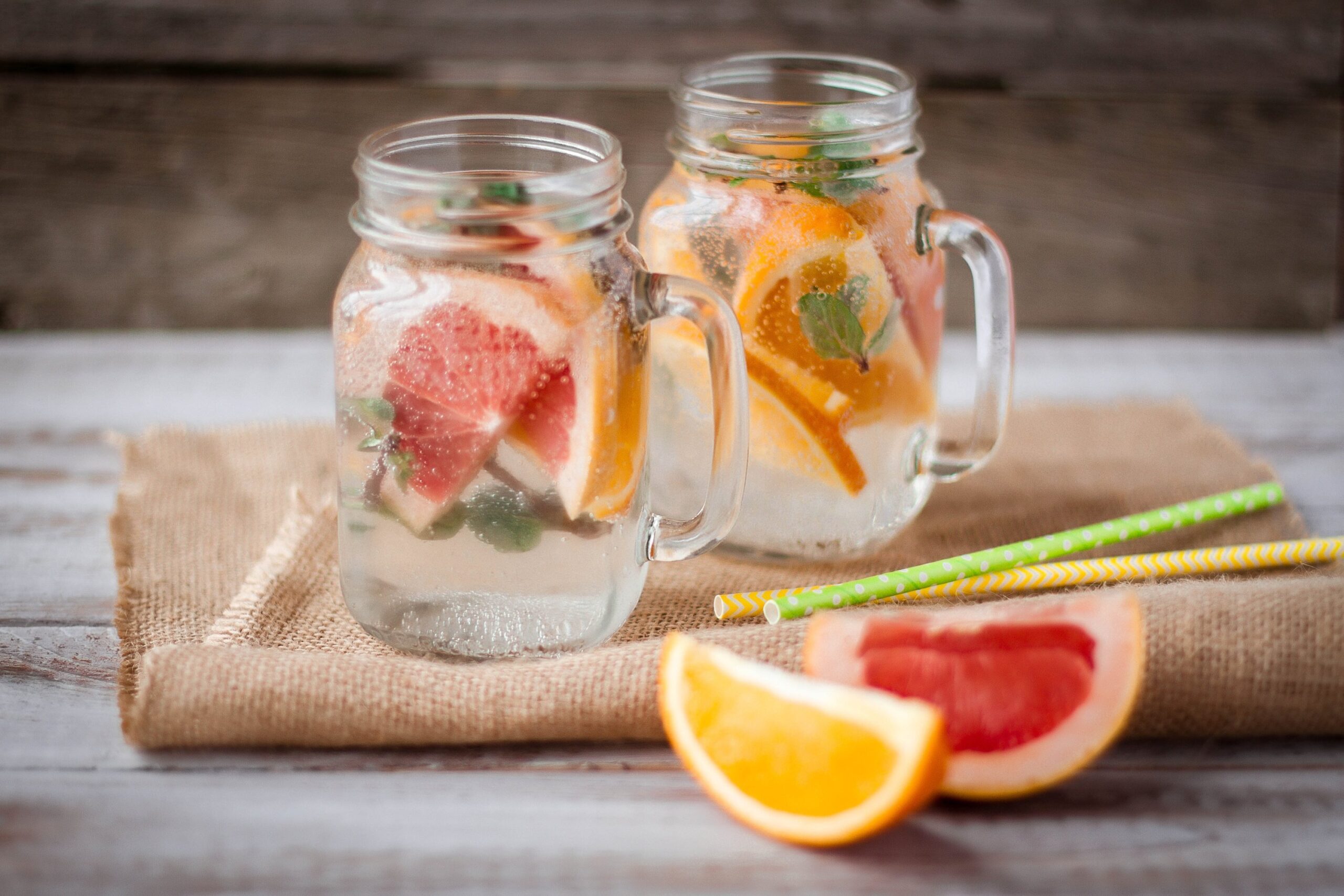 mason jar cocktails with fresh orange and grapefruit slices