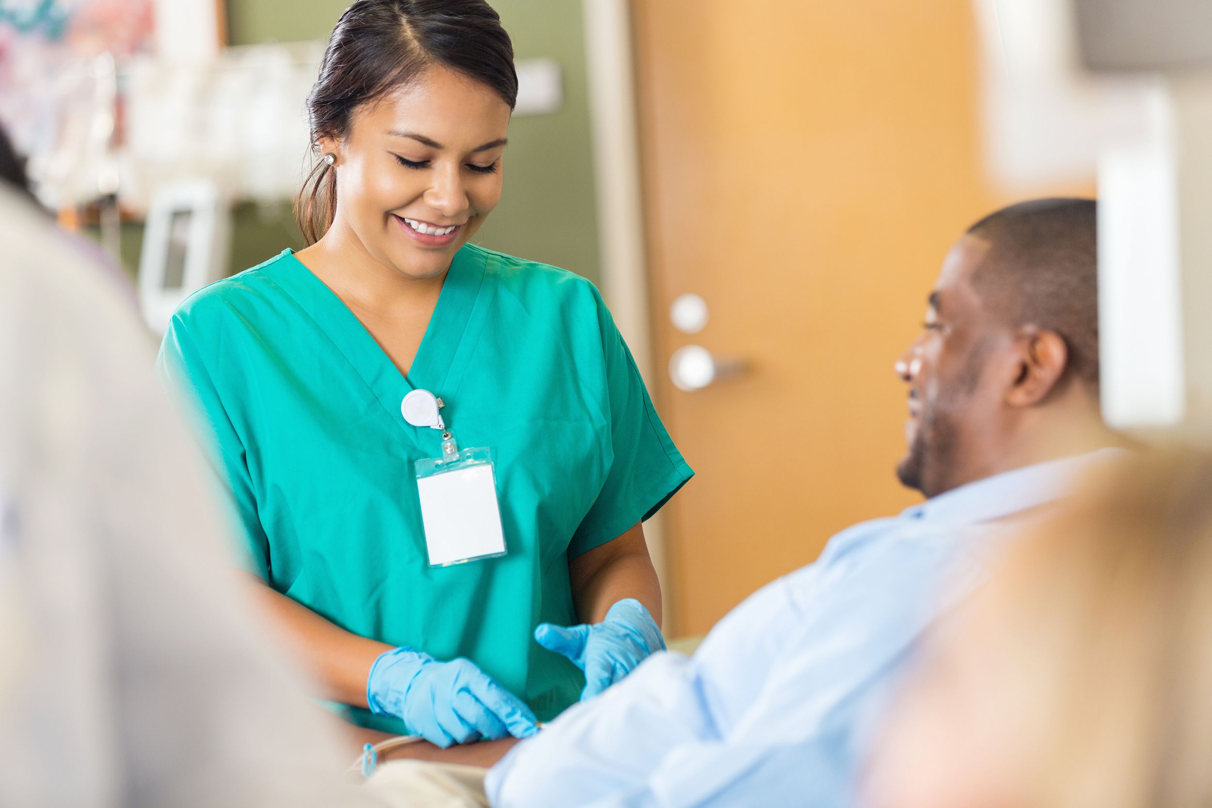 hospital phlebotomist taking a sample from a patient