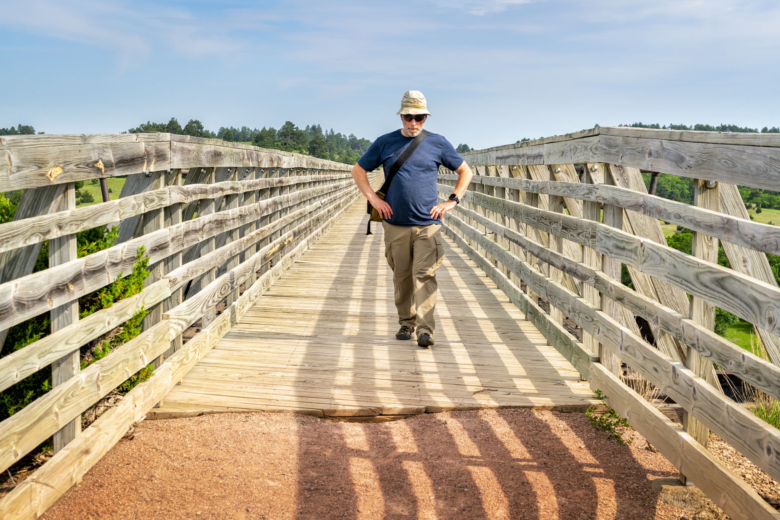 senior man walking on recreational Cowboy Trail in northern Nebraska