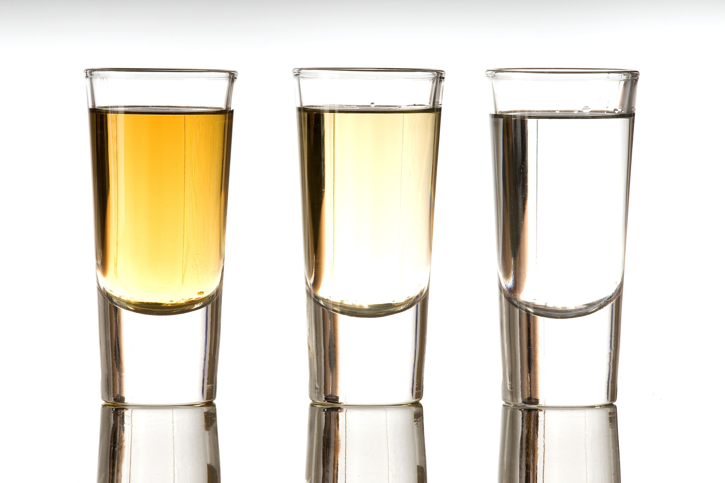 three different versions of tequila in shot glasses
