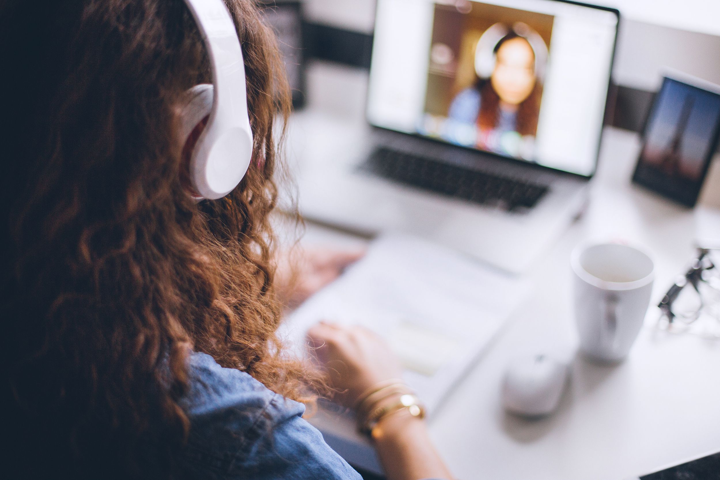 woman using laptop in her modern home office