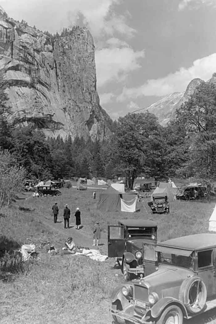 People camping with tents and automobiles in Stoneman Meadow, below Washington Column, Yosemite Valley, 1927
