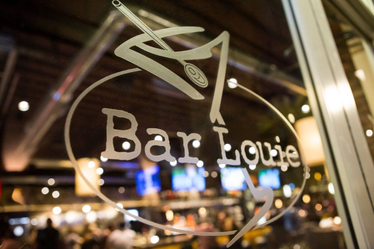 logo sign on the window of Bar Louie at The District, Tustin, California