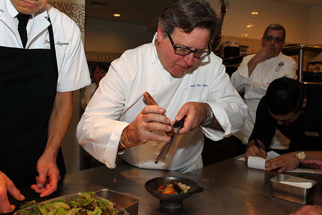 Chef Norman Van Aken prepares a dish for the Friends of James Beard Benefit