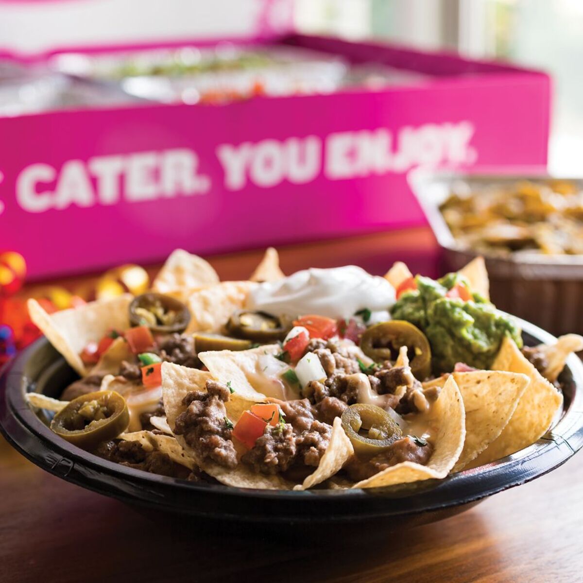 nachos with beef and topping from Taco Cabana, Houston, Texas on table