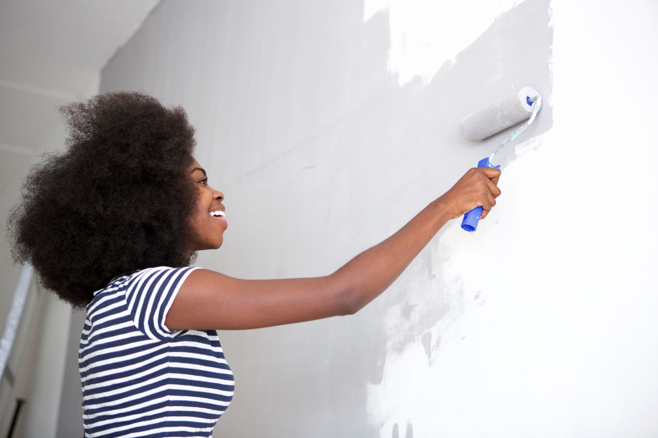 woman painting wall