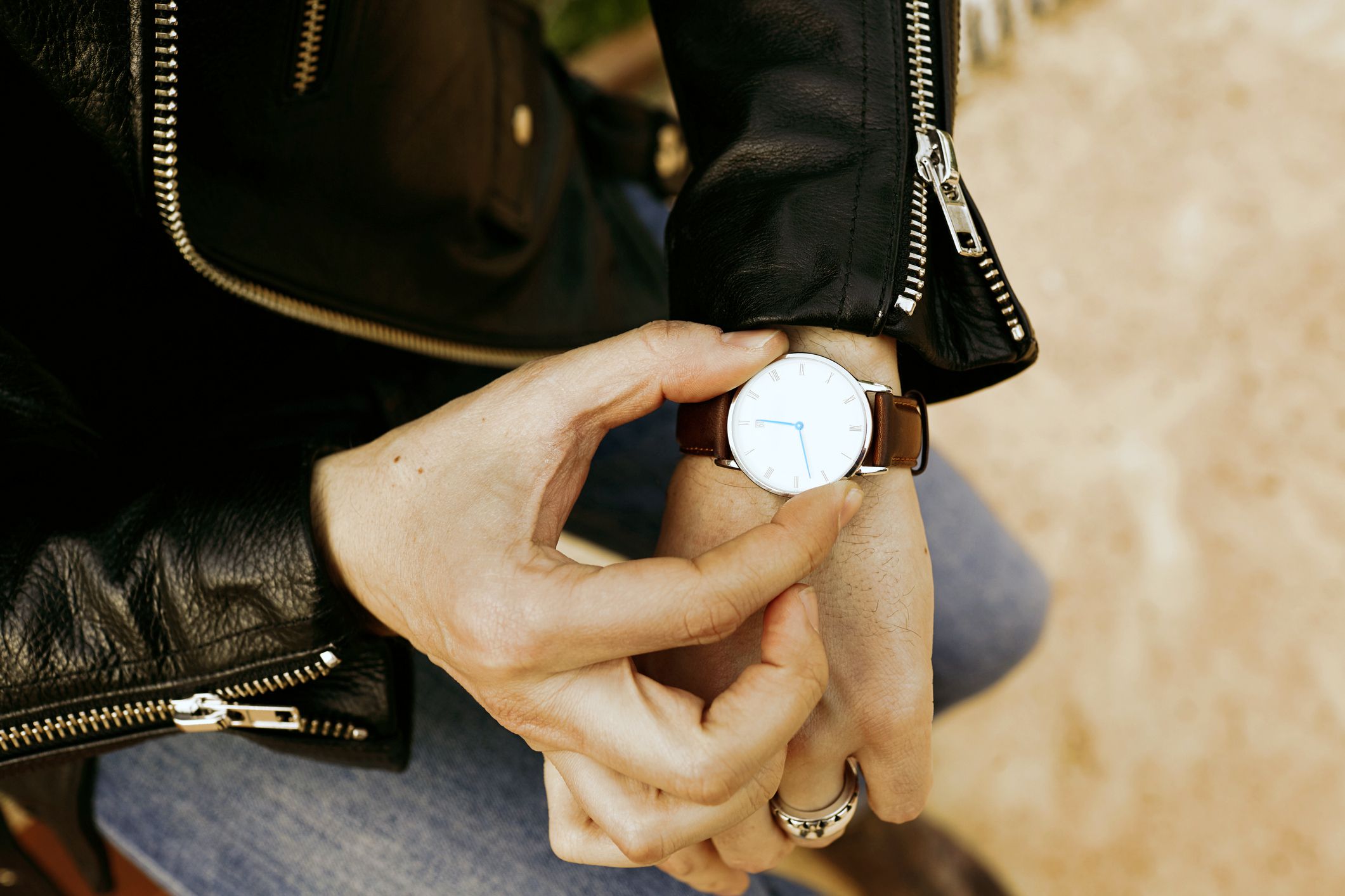 checking the time on wrist watch