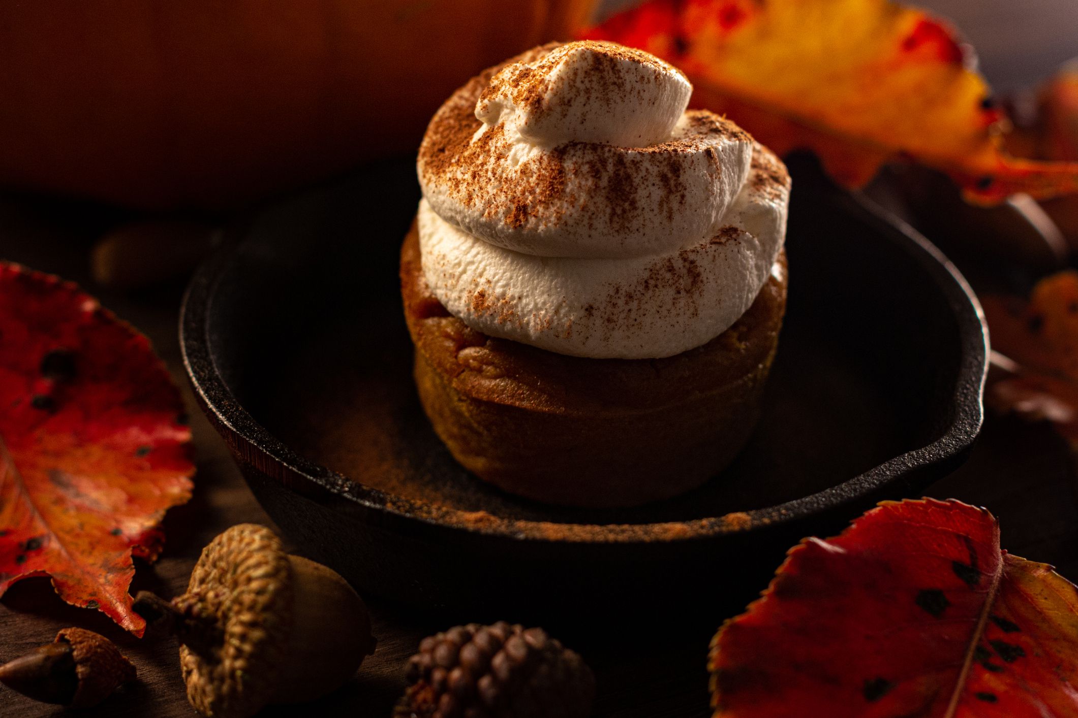 A pumpkin pie cupcake with fresh homemade whipped cream.