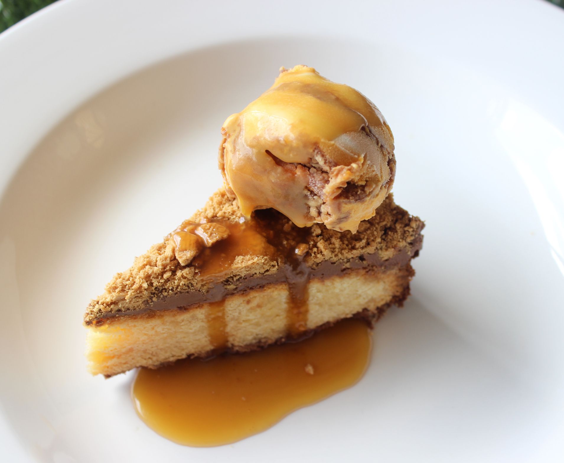 A golden cheesecake with honeycomb crumble, ice-cream and salted caramel