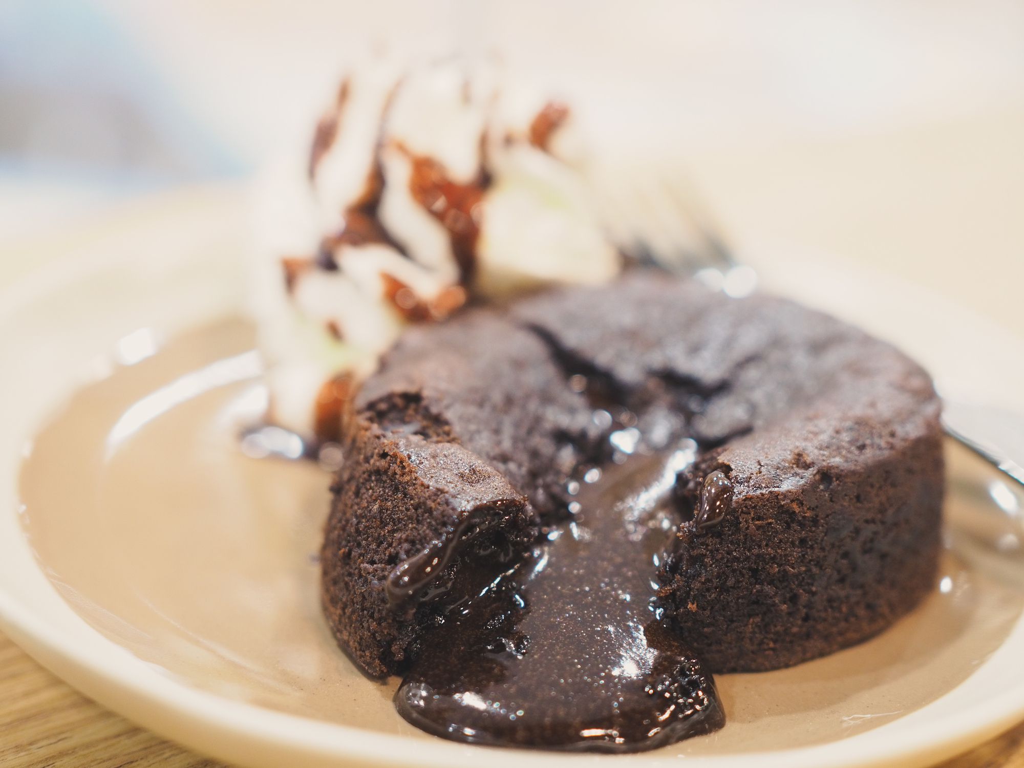 Close up chocolate lava cake with whip cream