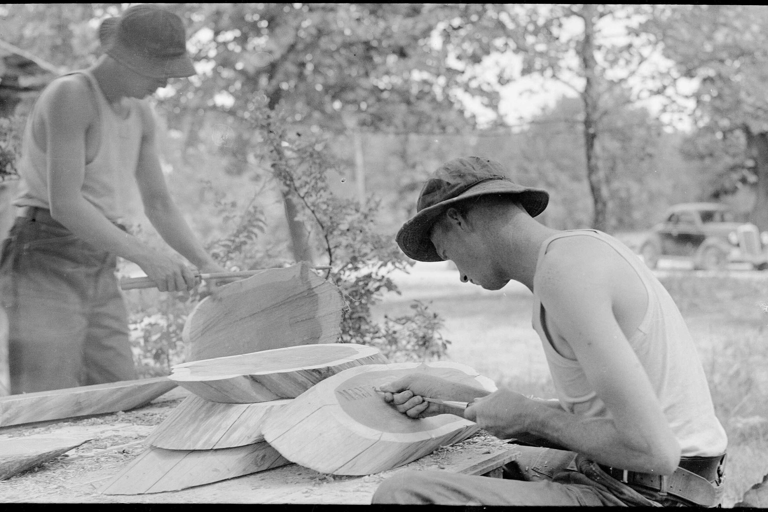 Enrollee printing signs in cedar with chisel and hammer, 1937