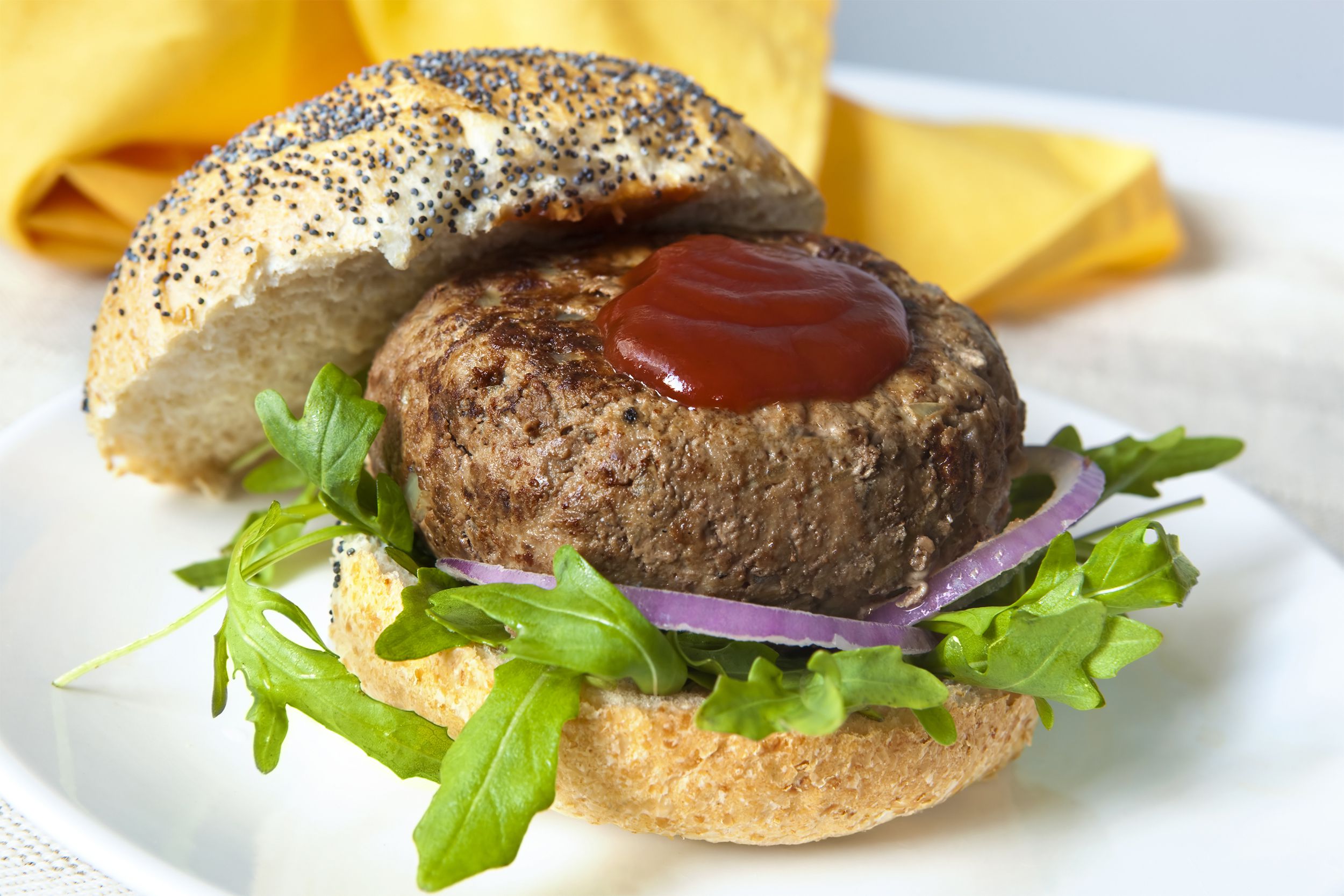 Thick burger patty with ketchup