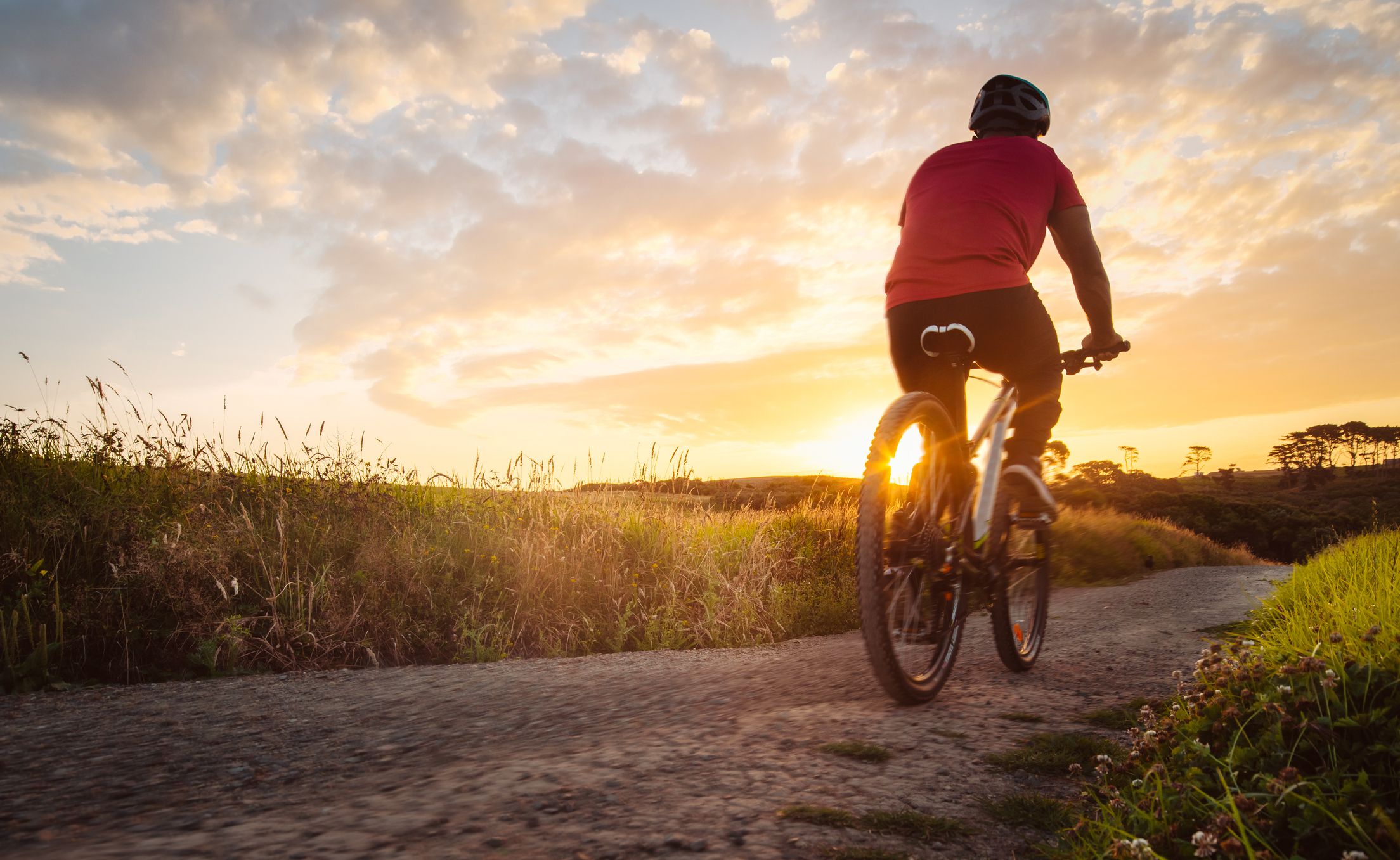 Bike riding outdoor during sunset in Long Bay, Auckland, New Zealand.