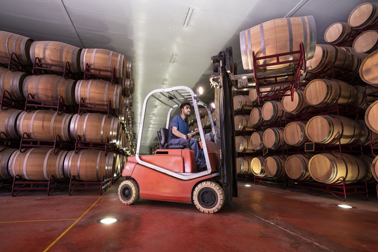 man working in wine cellar