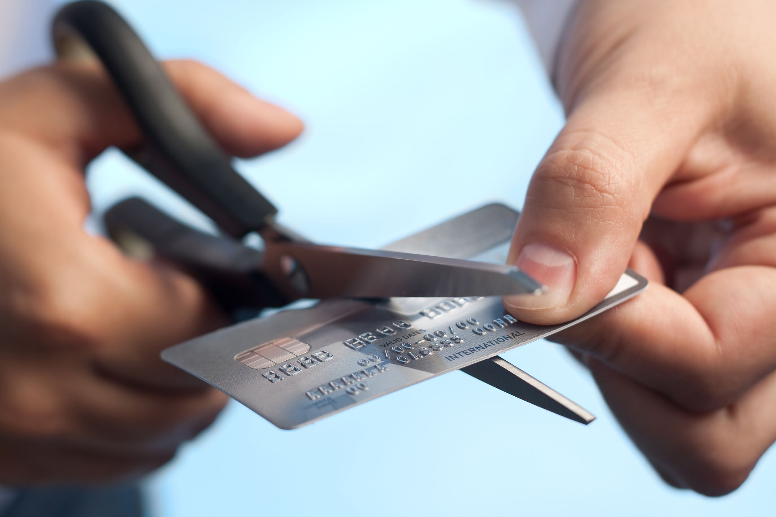scissors cutting a credit card