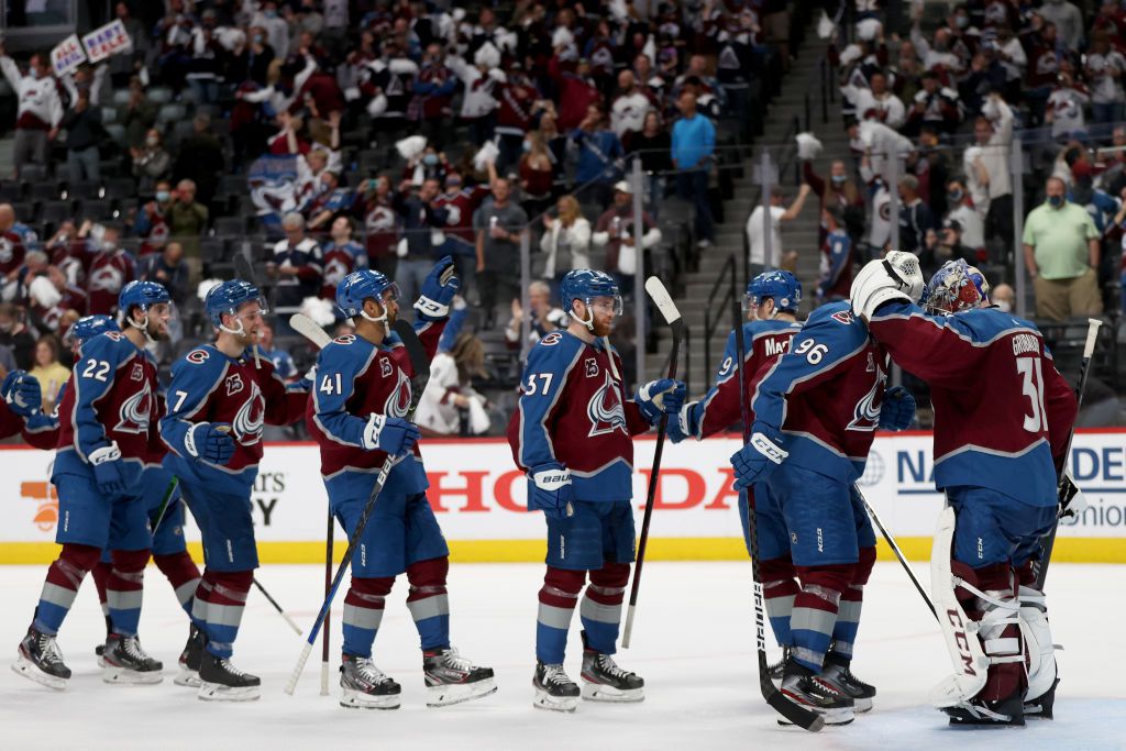 Goalie Philipp Grubauer #31 of he Colorado Avalanche is congratulated by his teammates after their win against the St Louis Blues in Game Two of the First Round of the 2021 Stanley Cup Playoffs