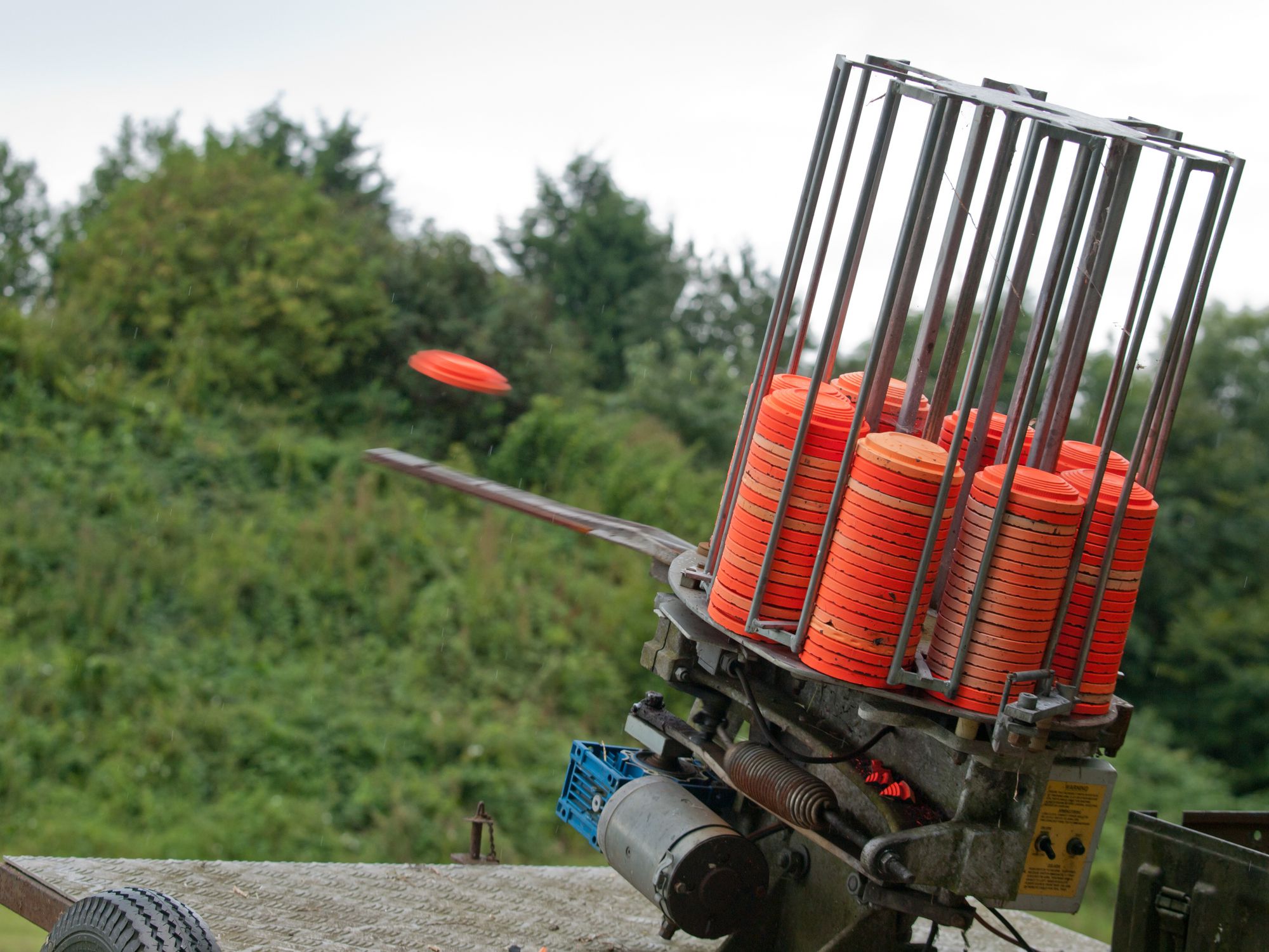 Orange clay pigeons fired from a trap