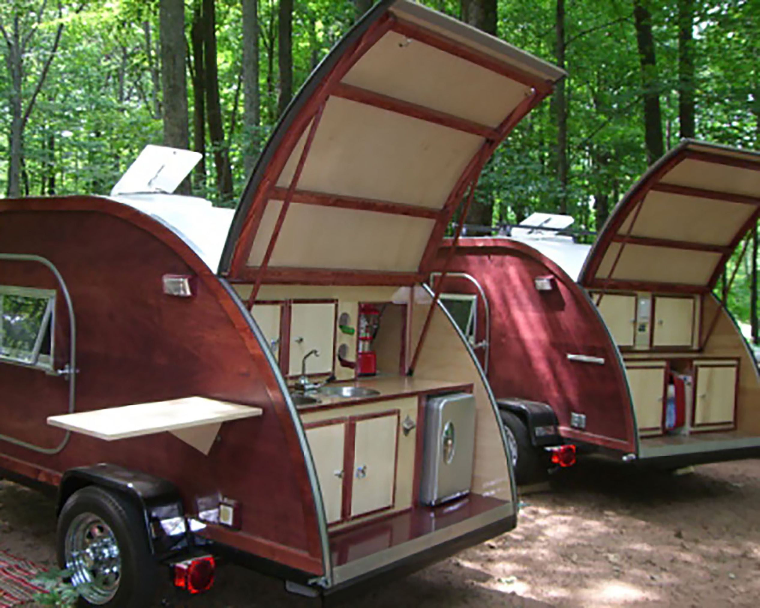 Two Big Woody Ultimate Teardrop Campers in forest.