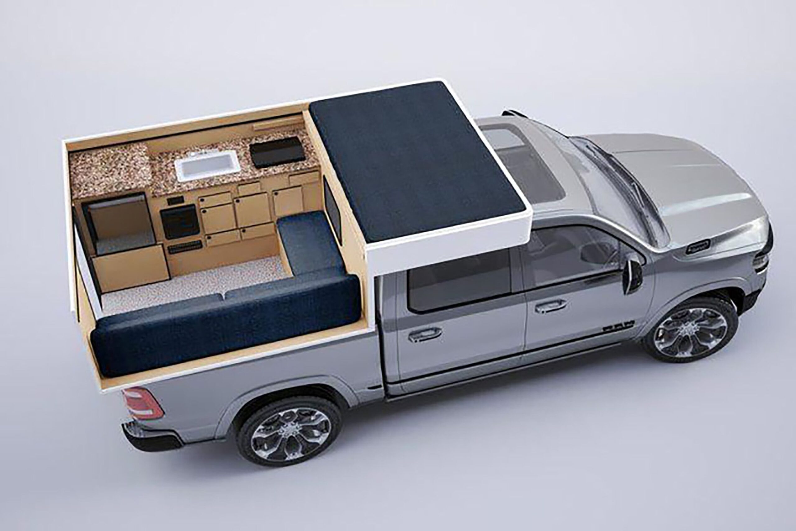 Fleet truck camper set up on a silver pick up truck.